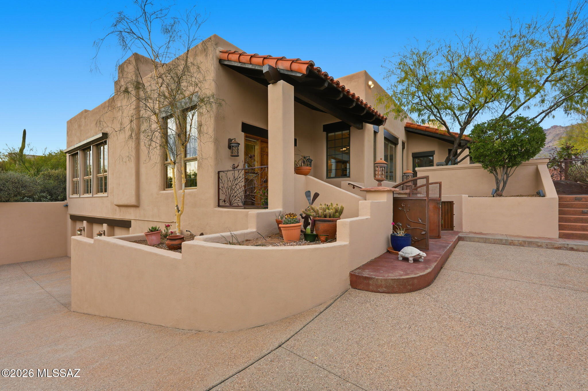 Located on a highly sought-after street within the prestigious, guard-gated La Paloma golf community, this exceptional home offers luxury, privacy, and mountain views. The home features 5 spacious bedrooms and 3 well-appointed bathrooms, with newly painted interior and exterior creating a fresh, move-in-ready feel throughout. Designed for both comfort and entertaining, the expansive outdoor living space includes a sparkling pool and spa, and a charming wood-burning outdoor fireplace--perfect for enjoying Arizona evenings against a stunning mountain backdrop. The seller will pay off the solar loan at closing, providing added value and peace of mind. Additional highlights include a long, private driveway leading to a 3-car garage