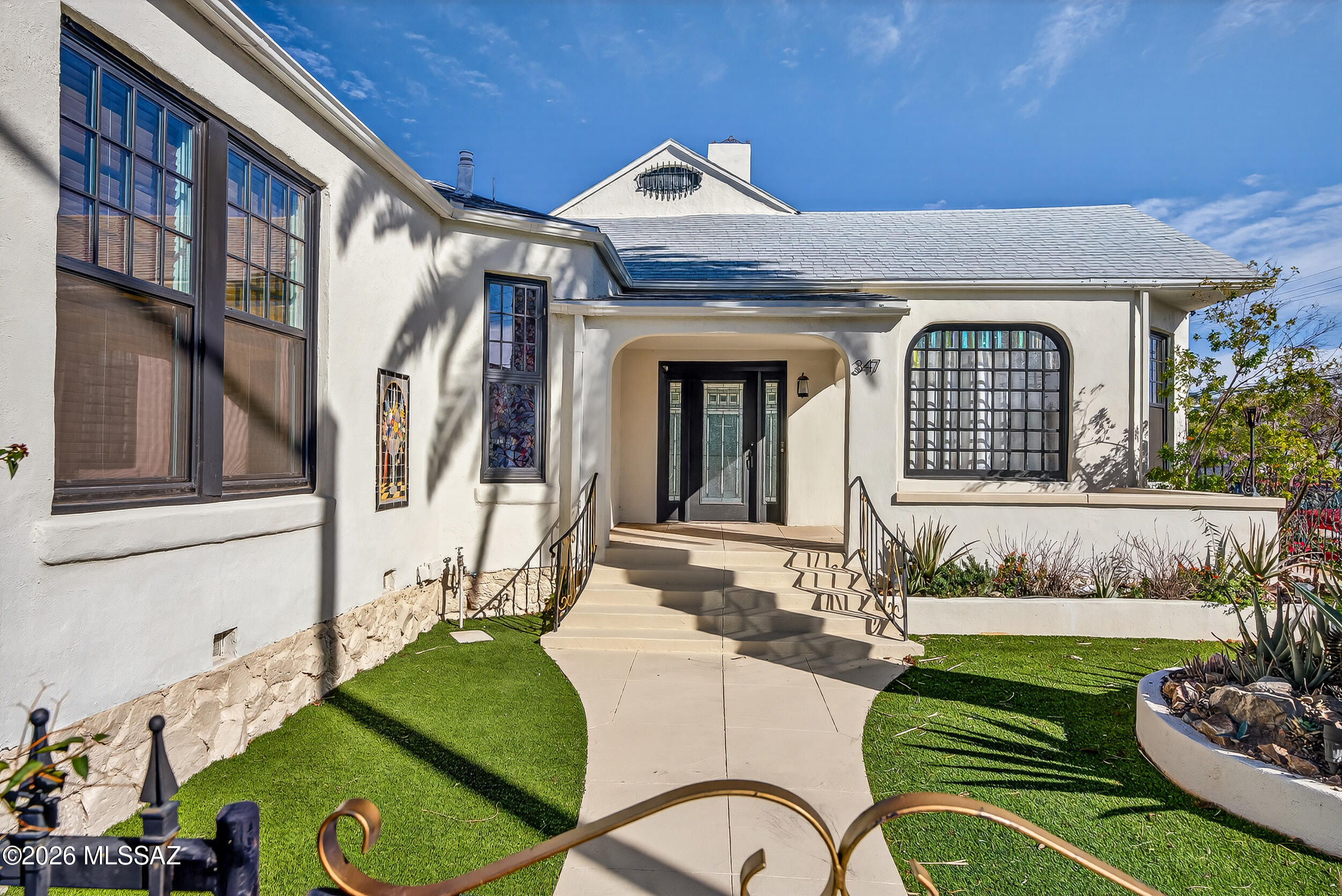 One-of-a-kind opportunity in the heart of Tucson's historic Armory Park! This fully renovated 1903 main home with a 1926 guest house offers endless flexibility: live in one and rent the other, run a home business, or enjoy multigenerational living. The main home includes 3 bedrooms plus an office, restored clawfoot tubs, soaring ceilings, picture rail molding, and mahogany Palladian windows. The private guest house features its own kitchen, bath, and entrance. Over $150,000 in Recent upgrades: new roof systems with warranties, all-new windows, remodeled kitchen and baths, refreshed hardwood floors, and redesigned landscaping with turf and pavers. C-3 zoning and detached 2-car garage with mini-split system add unique value. All just steps from cafes, museums, and vibrant downtown life! Successful Air B n B. 345 & 347 S 6th Ave offers a rare opportunity to own a fully renovated property in Tucson's sought-after Armory Park neighborhood. Blending historic preservation with thoughtful upgrades, this unique home includes a 1903 main residence and a 1926 guest house, each updated for comfort and versatility.

Main Home Overview: From the moment you step through the stained-glass front door, you're greeted by a copper-leafed atrium ceiling and art deco wood arch a true conversation starter. The spacious great room features high coved ceilings, 7-foot Palladian mahogany windows that flood the space with light, and a beautifully carved marble fireplace that anchors the room.

The home has three spacious bedrooms and an additional office/flex space. Two bathrooms have been fully restored with clawfoot tubs, original penny tile flooring, and beadboard wainscoting. The middle bedroom is currently styled as a luxurious dressing room, while the back bedroom includes an ensuite bath with exposed brick for added charm.

Kitchen & Upgrades: The kitchen has undergone a full transformation, now featuring updated cabinetry, surfaces, and fixtures. Additional upgrades include new lighting throughout, all new windows (excluding two original custom ones), re-coated original hardwood floors, and new doors that complement the home's character.

Guest House Details: With its own private entrance, the guest house is a fully equipped one-bedroom, one-bath dwelling with a full kitchen including a dishwasher. It operates as a successful Airbnb with a strong revenue history and glowing guest reviews. This setup allows for income generation or private accommodations for guests or family.

Outdoor Living & Garage: The outdoor spaces have been completely reimagined with turf, sidewalk pavers, large tree removals, and low-maintenance landscaping. Enjoy outdoor dining under the covered front patio or in the lush side yard surrounded by flowering greenery. The private backyard is ideal for gatherings or relaxation. A detached 2-car garage is fully finished, featuring a mini-split HVAC system ideal for use as a studio, office, or third unit.