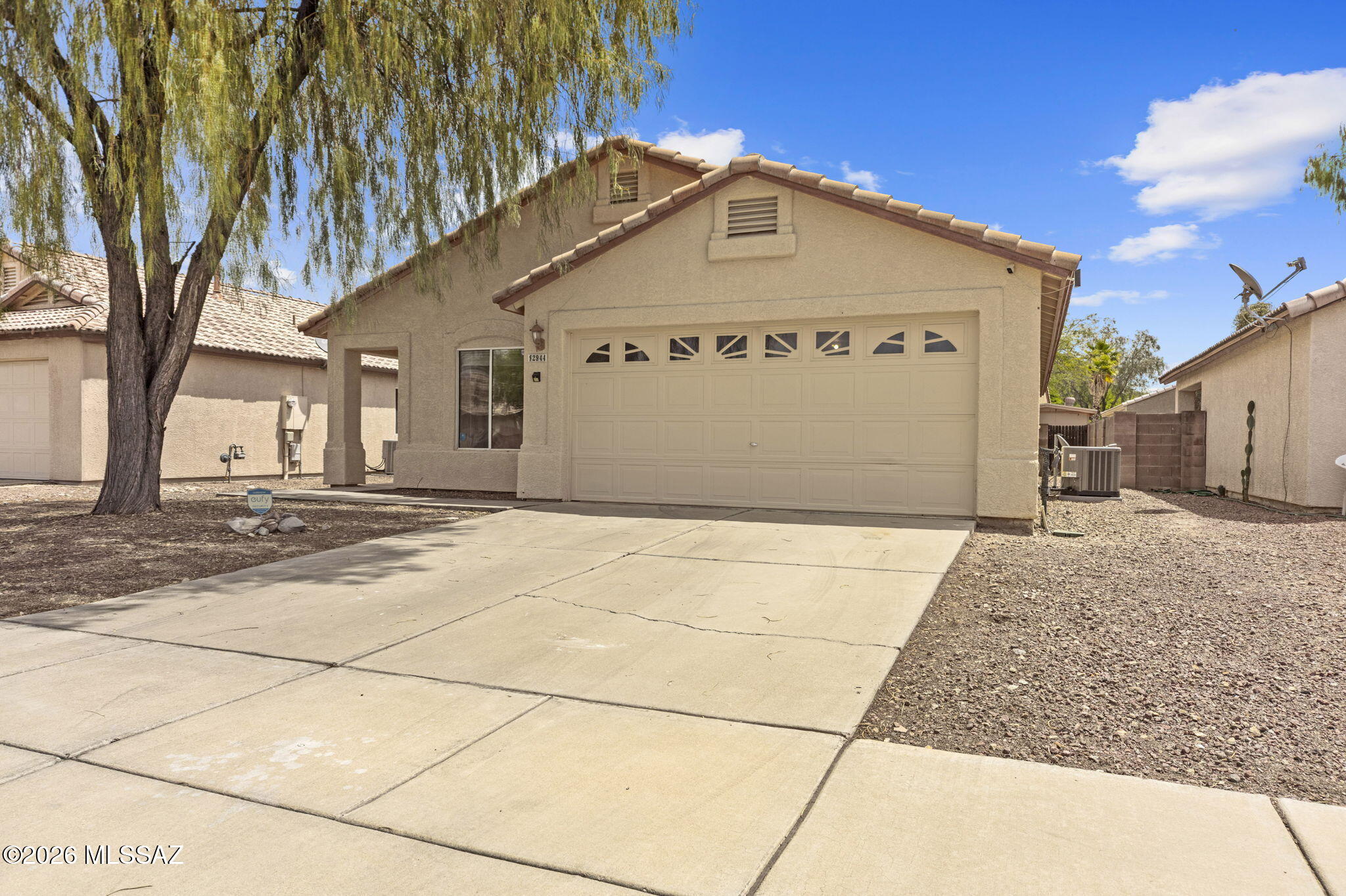 Beautiful updated 4-bedroom, 2-bath home in a quiet, friendly community. Enjoy peace of mind with a new 3-stage HVAC system installed last year, plus a bright, functional kitchen featuring recently updated appliances, freshly-painted cabinets, and brand-new quartz countertops. The spacious backyard offers plenty of room to relax, play, garden, or create your own outdoor retreat. With easy access to major routes, you're just about a 15-minute drive to both the University of Arizona and Downtown Tucson--ideal for commuting and everyday convenience. A low HOA of around $22 every month adds even more value, and the home is just steps from a community playground, blending comfort, convenience, and neighborhood charm.