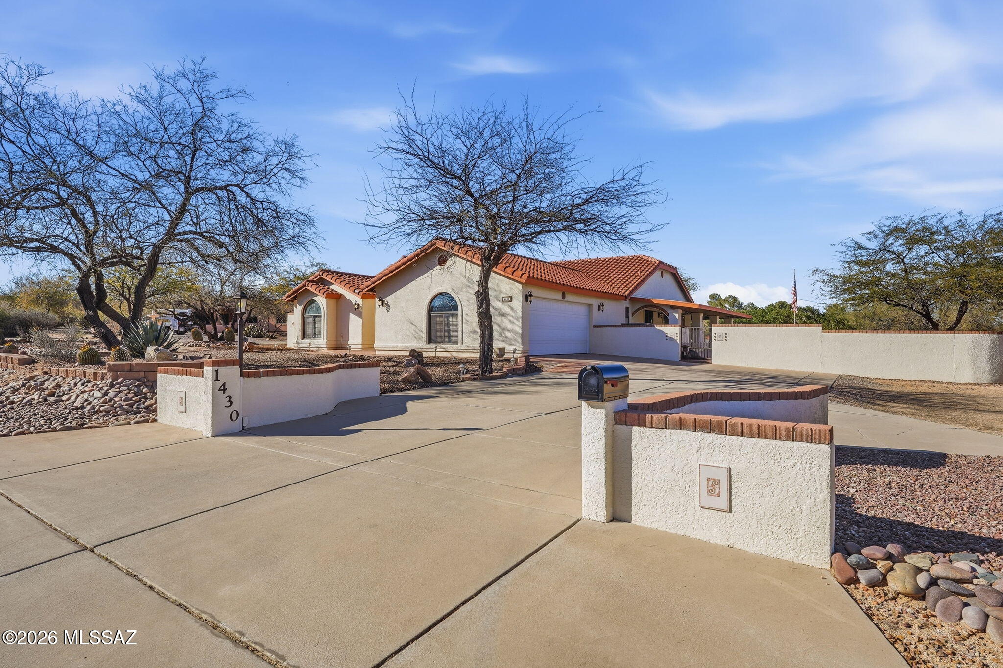 Offered by the original Owner, this well-loved residence provides 3,221 sf of living space with a 2- car garage, split-floorplan of 3 bedrooms and 3 full bathrooms. The generous 1.39 acre corner lot offers ample room for RV parking. The open layout flows seamlessly, with a canvas for endless possibilities for a new, modern look. Extend  everyday enjoyment to the outdoor living space. The backyard features  2 built-in barbecue grills, dedicated beverage bar, and a covered patio enclosed by a block wall for privacy. Whether you're hosting weekend cookouts or simply soaking in those legendary Arizona sunsets, this space is designated for making memories. Located just minutes from the interstate and local restaurants, bringing a perfect balance between peaceful retreat and modern convenience.