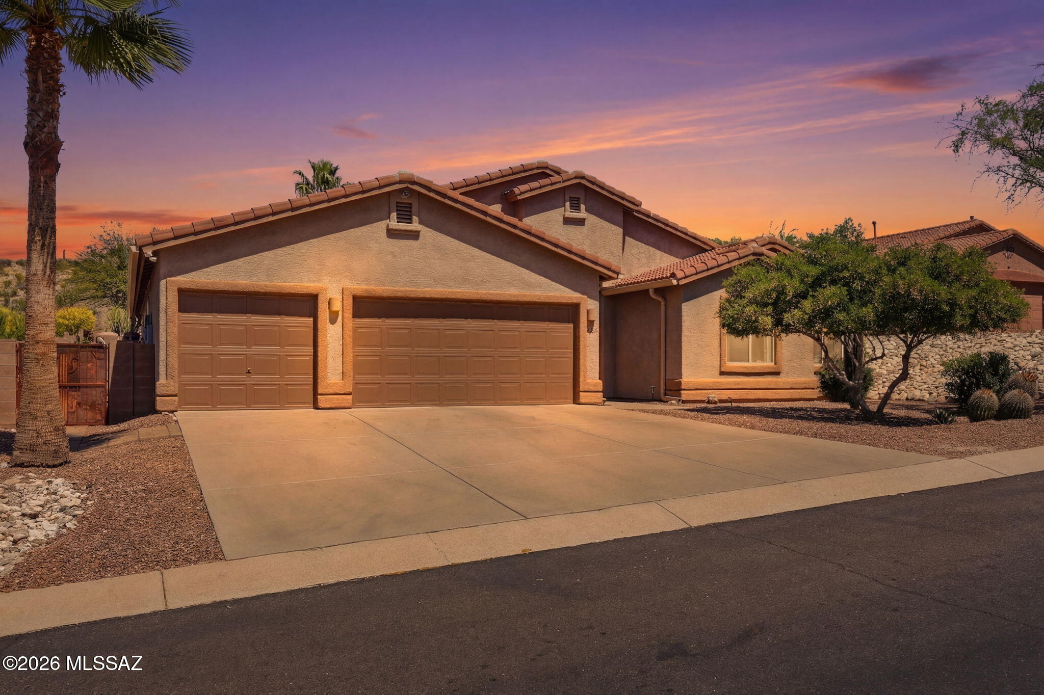 Immaculately maintained and beautifully appointed, this 2,472 sqft home in desirable gated Rancho Cancion community offers flexible living with high ceilings and lots of natural light. The updated chef's kitchen features a high-end Thermador Pro gas range, Quartz countertops, breakfast bar, conversation island, and pantry. This split bedroom plan includes 3 bedrooms plus den/office/4th bedroom. The primary suite offers a luxurious bath with heated floors, extended shower, dual sinks, granite counters, and walk-in closet plus direct patio access to the north-facing, tiered backyard with pergola kitchen area, turf grass, firepit, citrus tree, and flagstone paths. Owned solar, newer roof, water harvesting system, and 3-car garage complete this .37-acre gem near Saguaro National Monument East. THE PROPERTY
> Desirable Gated Rancho Cancion Neighborhood
> .37-acre Parcel 
> Minutes from Saguaro National Monument East
> North-Facing Enclosed Backyard
> Pergola Outdoor Kitchen Area
> Low-care Landscaping with Mature Vegetation, and Irrigation
> Water Harvesting System
> Turf Grass
> Tiered Backyard with Sitting Areas and Firepit
> Flagstone Walkways
> Tangerine Citrus Tree

THE HOME 
> Immaculately Maintained
> 2472 Square Feet of Living Area
> Flexible Space with Living and Dining Room Combination and Family Room Off Kitchen or as currently being used with Large Living Room and separate Dining Room
> High Ceilings with Lots of Windows
> Updated Chef's Kitchen with High-End Thermador Pro Natural Gas Range, Full Size Side-By-Side Refrigerator/Freezer unit, Quartz Countertops, Breakfast Bar, Conversation Island, and Pantry Closet
> Split Bedroom Plan
> 3 Bedrooms plus Den/Office/4th Bedroom
> Primary Bedroom Suite has Direct Access to Covered Patio and Backyard
> 2 Bathrooms
> Spacious Primary Bathroom has Heated Floors, a Custom Extended Shower, Dual Sinks, Granite Countertops, and a Large Walk-in Closet
> Guest Bathroom has Dual Sinks, Tub/Shower Combo and Granite Countertops
> Shade Screen at Front Entrance
> Front Door Keypad Locking System 
> Covered Patio
> Spacious 3-Car Attached Garage 
> Owned Solar Electric System
> Water Softener & Reverse Osmosis
> Newer Roof
