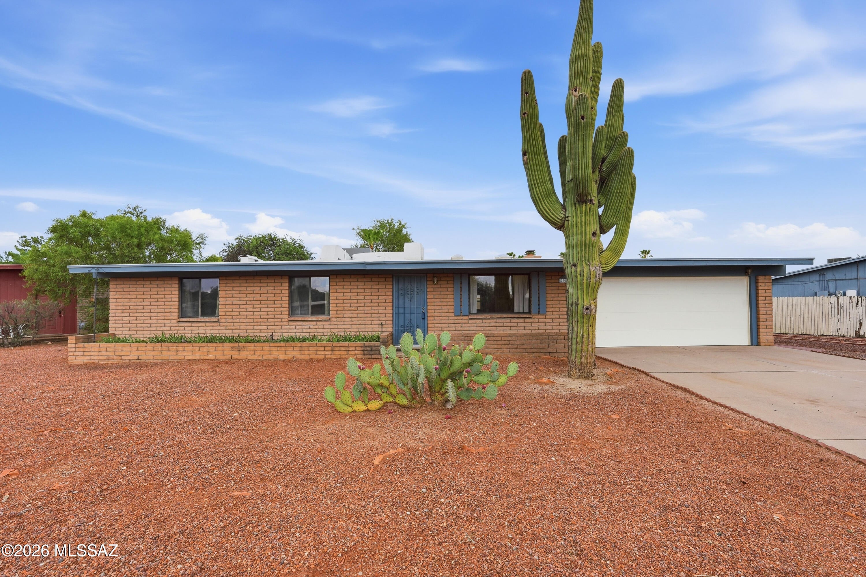 Welcome home!! This nicely updated 3-bedroom home is situated on a spacious lot, in a desirable Northwest location. There's no HOA and it's located within the sought-after Marana School District. Inside, you'll find tile flooring throughout, for easy maintenance, along with new closet doors, updated ceiling fans, and modern light fixtures that give the home a fresh, inviting feel. The large lot offers plenty of room to entertain, garden, or create your own outdoor oasis. Conveniently located near shopping, dining, parks, and more, this move-in-ready house combines comfort, style, and a fabulous price!