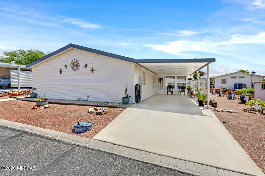 Very nice well cared for 3 bedroom 2 bath home with carport, AZ room, and shed/workshop. New roof recently installed in December 2025. HVAC system is less than 5 years old. Newer flooring and freshly painted. Split bedroom floor plan with primary bedroom in the front and other two bedrooms in the rear of home. Kitchen has an island and newer wall oven. Laundry is in a room off the kitchen. The hallway has been expanded to include space for an office. Located in Copper Crest, a gated Active Adult Community, residents enjoy resort-style amenities including swimming pool, spa, shuffleboard, pool table, fitness center, hiking and biking trails, and more--all just a short drive from Tucson.
Best of all--you own the land!