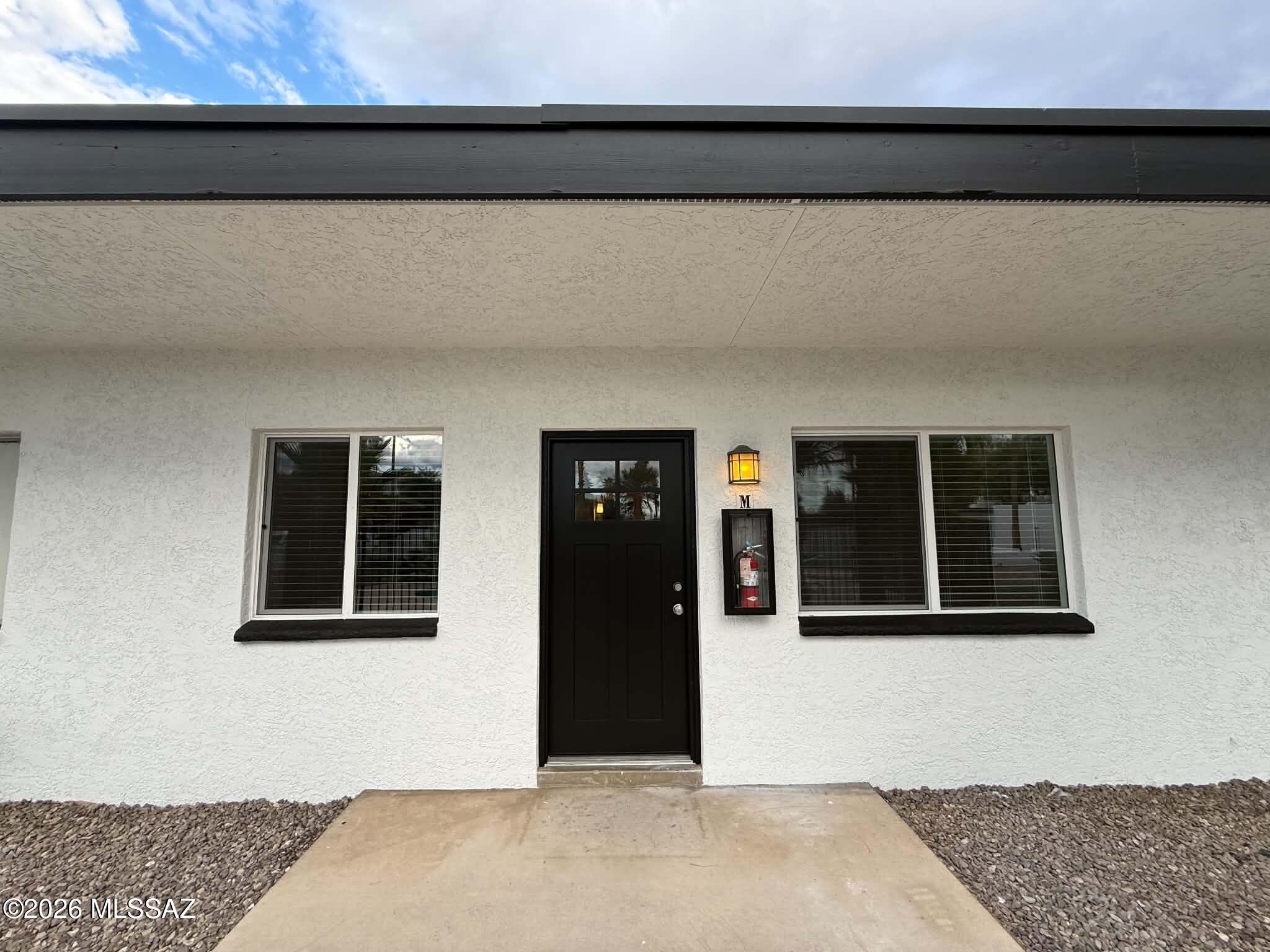 Charming 2 bedroom, 1 bathroom home offering approximately 800 sq. ft. of comfortable living in a quiet, well-maintained community in central Tucson. This inviting unit features wood-look vinyl flooring throughout with no carpet, creating a clean and low-maintenance living space. The functional kitchen comes equipped with a refrigerator, stove, oven, microwave, dishwasher, and disposal, while the in-unit washer and dryer provide added everyday convenience. Enjoy year-round comfort with air conditioning, ceiling fans, and heating. Step outside to your own private fenced backyard, perfect for relaxing or spending time outdoors. Residents also have access to a refreshing community pool. Conveniently located near the University of Arizona, shopping, dining, parks, and major roadways. This pet-friendly home offers an excellent combination of comfort, convenience, and location. Schedule your showing today!