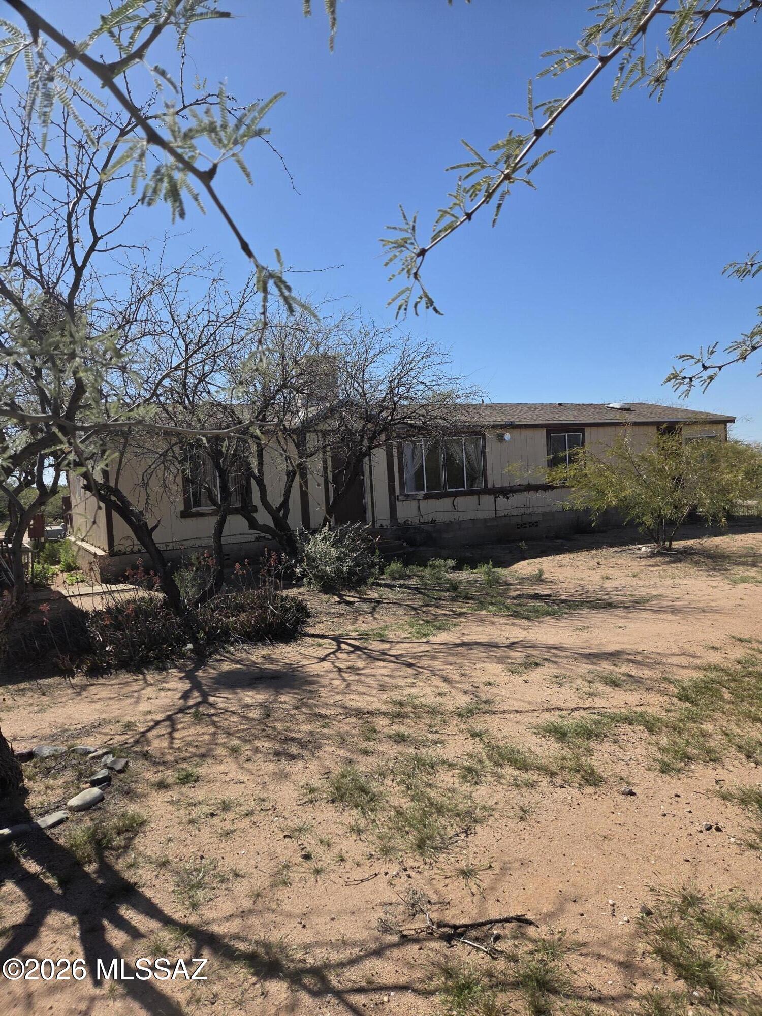 Fix-up!  Seller will carry at 9%!  Perfect home to live in while you fix it up and build equity.  Hard to find a property in Vail with such potential!  Water Bill currently only $40/mo. Only 180' from paved road.  Better hurry on this one!  Please use Charles Flint w/First American Title 520-219-6451 8500 N. Oracle Rd. #100 Oro Valley, AZ  85704. Title Report already finished.