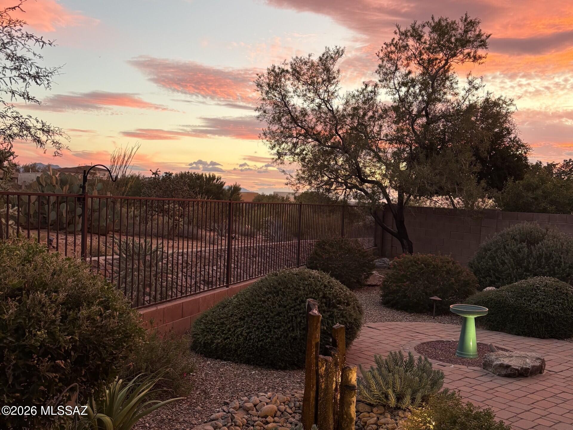 Beautiful original owner 2BR+Den/2BA  2.5 Car extended length garage in 55+ community of Del Webb at Rancho del Lago w/desert view & no neighbors directly behind home.Large oversized back patio perfect for enjoying a cup of coffee or tea watching our migrating birds & wonderful Arizona sunsets.Interior is gorgeous w/tile everywhere except BR's. Gourmet kitchen w/separate gas cooktop, light colored granite, tiled backsplash, upgraded cabinets, & oversized breakfast bar.Guest BR is very spacious & guest bath is awesome w/Stone & Tiled walls Primary BR has bay window w/automatic blind & private view out back.Primary bath w/dual sink,large shower, & a very spacious walk in closet is a great feature.Garage has built in storage cabs & desk.Solar is owned & saves $$ on electric bills. Super Home!