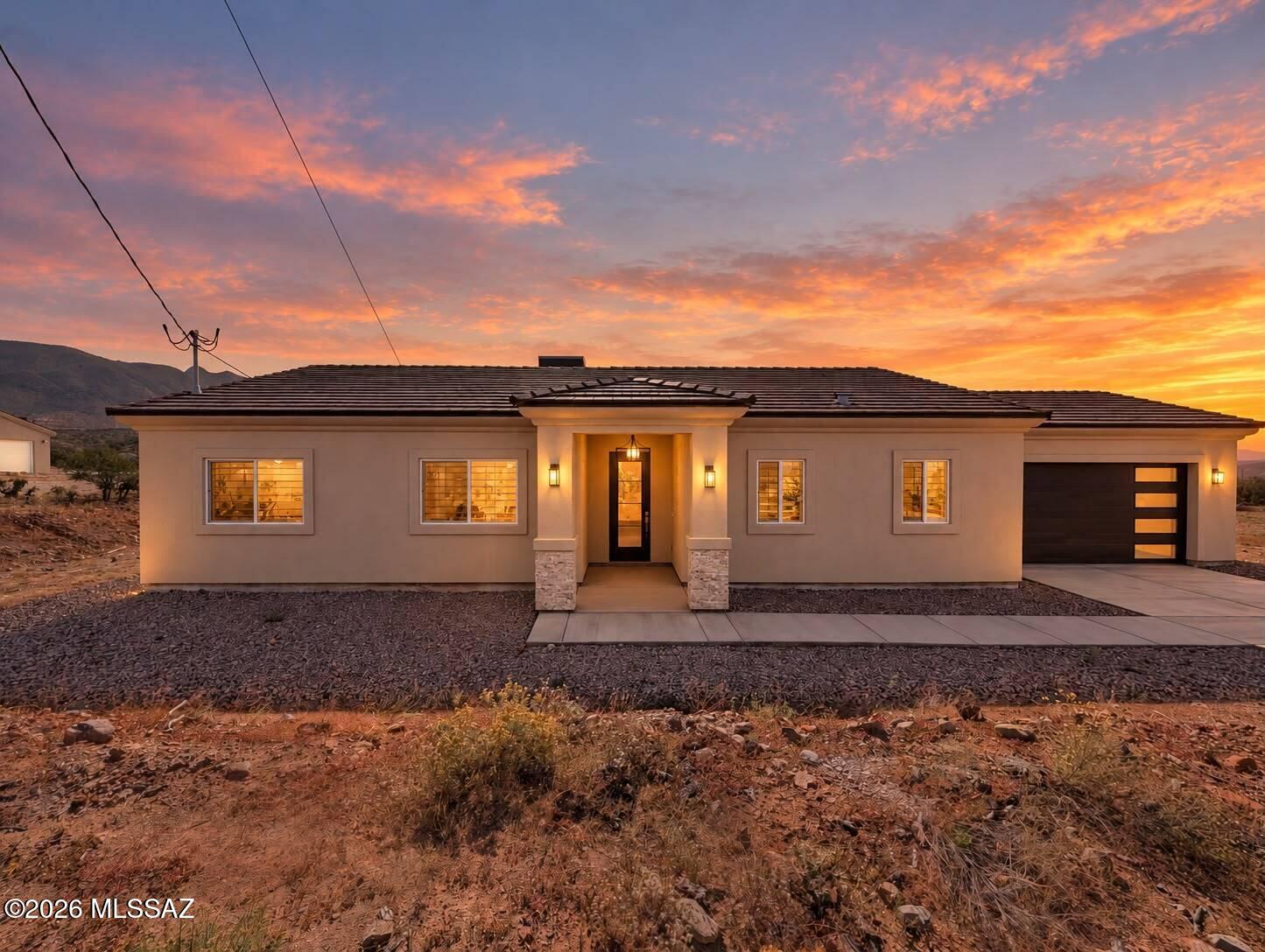Owner-Agent - Brand-new construction in Rio Rico, ready for its new owners! This beautiful single-story home offers 3 bedrooms, 2.5 bathrooms, a 2-car garage, and a concrete driveway. Inside, enjoy wood-look tile throughout, blinds, ceiling fans, and TV mounts already in place. The spacious upgraded kitchen features a large island, white cabinetry, granite countertops, and stainless steel appliances. Additional highlights include built-in storage cabinets in the laundry room, custom closet built-ins in the primary suite, and large walk-in showers. Fresh, modern, and completely move-in ready!