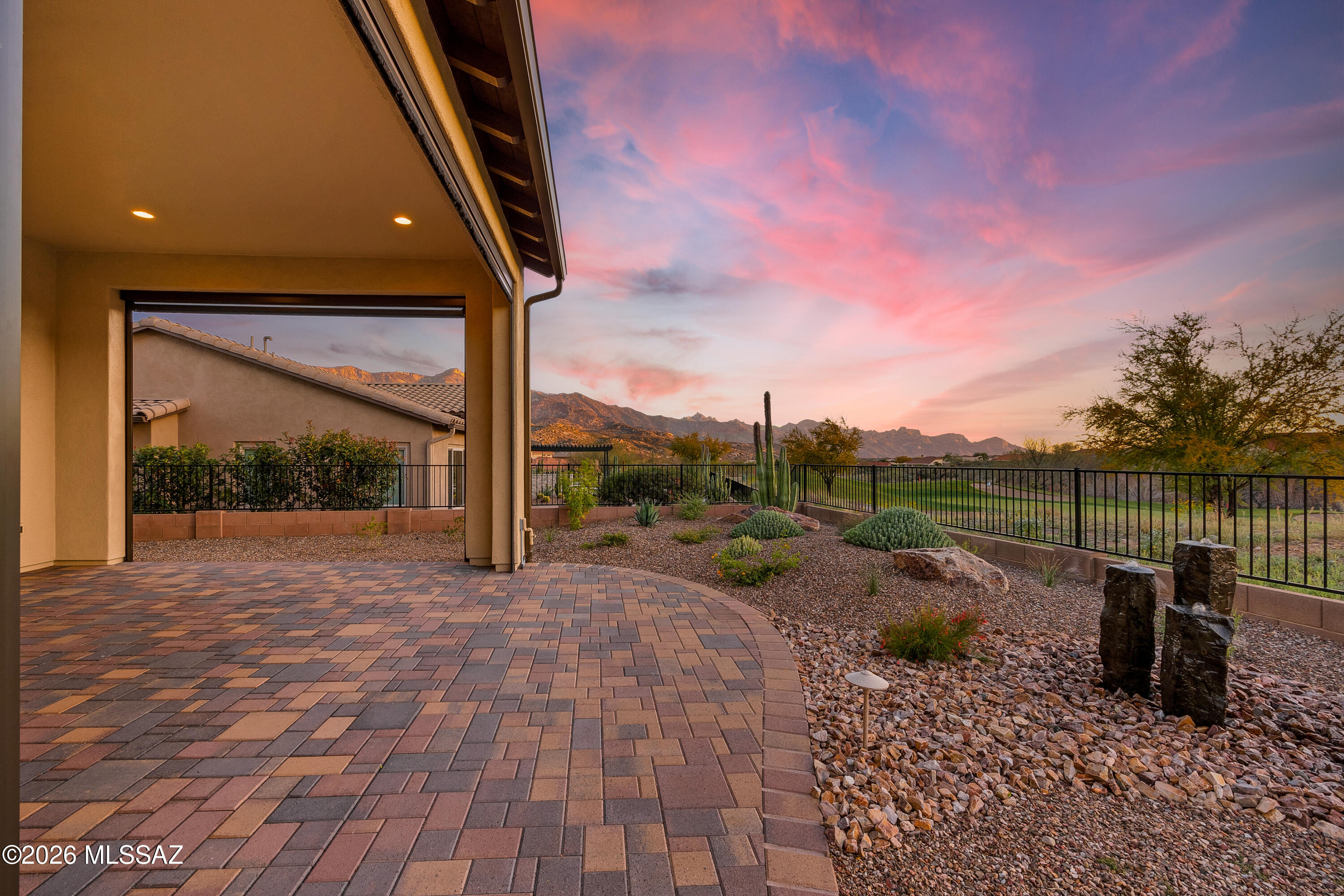 Perfectly positioned on a premium golf course lot on a quiet cul-de-sac in SaddleBrooke Preserve, this sought-after Canyon model captures what today's buyers are searching for-but rarely find in one home: stunning Catalina Mountain views from a south-facing patio, a thoughtfully designed layout, and a rare 4-car showroom-style garage. Enter through a gated courtyard to soaring ceilings, dramatic floor-to-ceiling view windows and neutral décor. Upgrades include travertine-look ceramic tile, plantation shutters, and motorized sunscreens to effortlessly enclose the patio, creating a true indoor-outdoor Arizona room for year-round living. The well-designed floor plan offers two ensuite bedrooms with ideal separation for owner and guest, a third flex-room/bedroom, powder room and multi-use den The gathering room with granite counters and luxury appliances. The owner's suite features a spa-like bath with curbless shower. The smart aggregate driveway sets the stage for the finished 4-car showroom garage, featuring bold deep red NewAge professional cabinetry. The rear patio with remote sunscreens overlooks the golf course with Catalina views, bubbling basalt fountain and private pergola-shaded hot tub patio. Experience the views, privacy and lifestyle that make SaddleBrooke Preserve one of Southern Arizona's most sought-after communities. See video tour.
