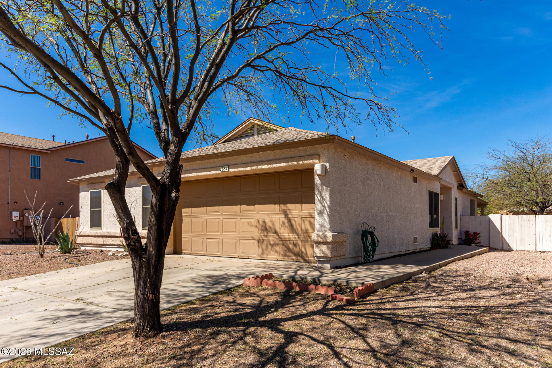You'll love this adorable 3-bedroom home with a den that's perfect for an office or 4th bedroom! Bright, open, and easy to enjoy with wood-look vinyl floors in the main areas and cozy carpet in the bedrooms. The kitchen features a gas range, stainless fridge, and opens right into the living and dining spaces so everyone stays connected. Huge backyard with a covered patio--great for BBQs or relaxing with friends. The roomy primary suite offers dual sinks and a walk-in closet. Nestled in a popular SW neighborhood, close to schools, restaurants, and shopping!