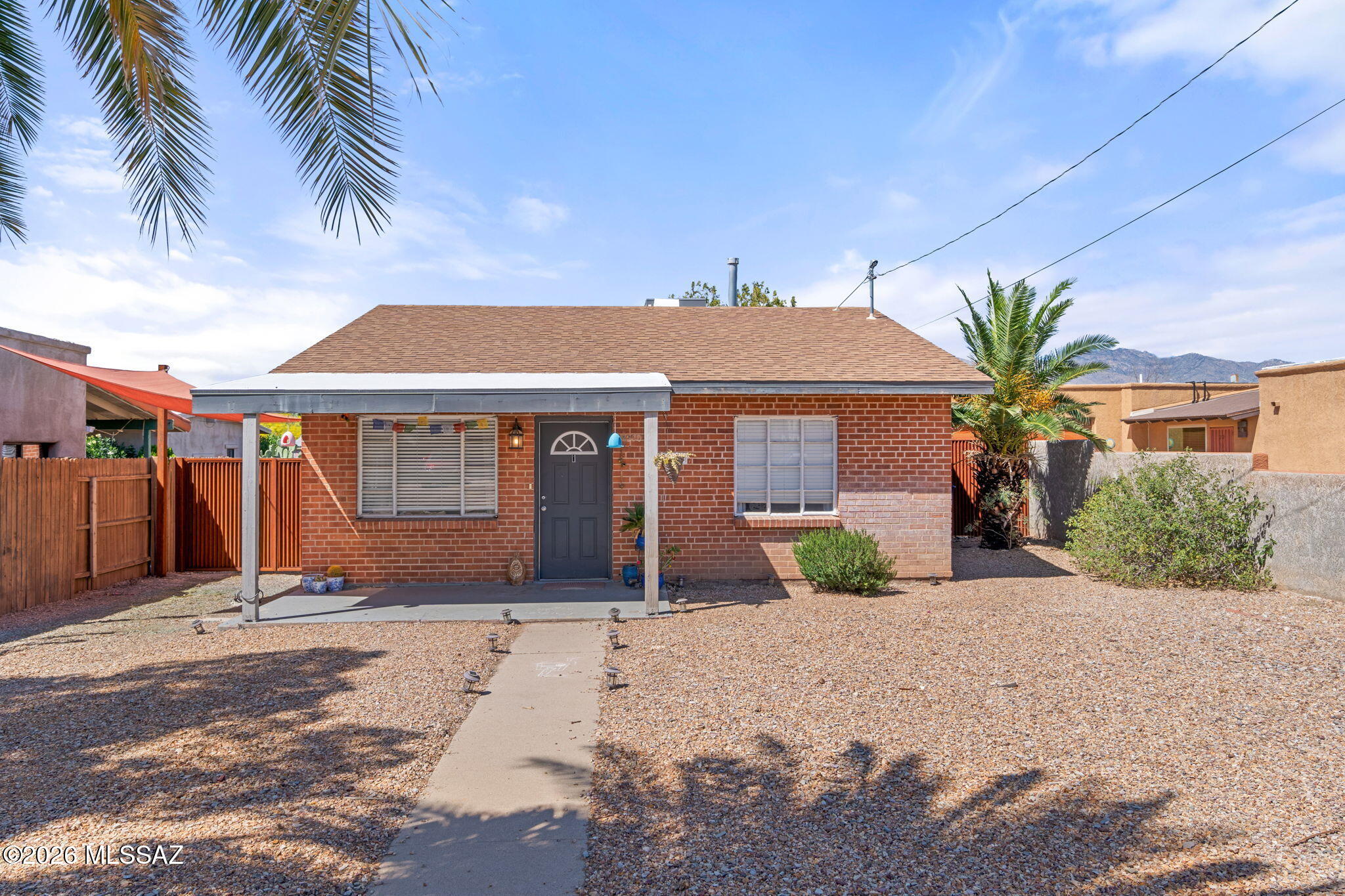 **Special 1-0 Buydown Rate available for qualified buyers! Enjoy a reduced interest rate during the first year of your mortgage. Contact listing agent for complete details and lender qualifications.** Welcome to this charming Tucson home in a centrally located, highly desirable neighborhood! This inviting residence offers the perfect blend of comfort, character, and convenience. Inside, you'll find a light-filled floor plan with comfortable living spaces, a welcoming kitchen, and well-sized bedrooms designed for everyday living and easy entertaining. The spacious backyard provides plenty of room to relax, garden, or create your own private retreat. Ideally located just minutes from dining, shopping, parks, and the UofA.
