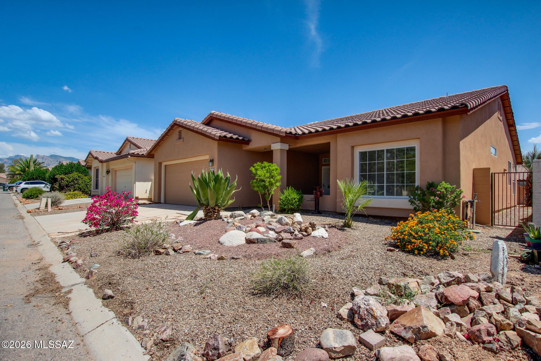 Range price, Seller will accept or counter offers between $334,700-$344,700. Beautifully updated 3-bed, 2-bath home in the desirable North Ranch community! This move-in ready home features a split-bedroom floor plan, spacious living room, and abundant natural light throughout. The kitchen showcases white cabinetry, solid-surface countertops, tile backsplash, stainless steel appliances, and a bright breakfast nook. The private primary suite offers a large walk-in closet and a spacious walk-in shower. Neutral finishes, updated flooring, and tasteful touches make this home feel warm and inviting. Enjoy a low-maintenance backyard with a covered patio. Located in the Marana School District and close to shopping, dining, parks, and I-10. Seller holds an active real estate license in Arizona.