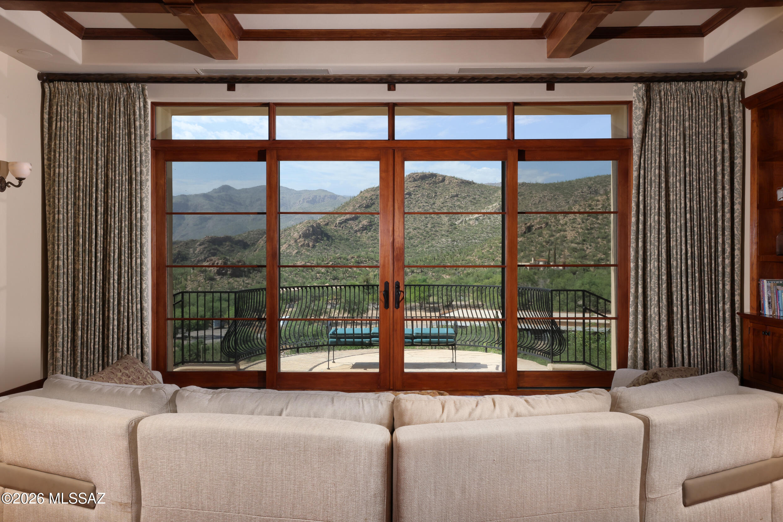 Commanding one of Redington Ranch Estates' most spectacular settings, this architect-designed Ron Robinette residence is a masterful expression of Contemporary Southwest luxury. Poised on more than 3 private acres, the 5,027 sq ft Estate showcases Breathtaking Panoramic Mountain & City views through walls of glass that seamlessly connect refined interiors with extraordinary outdoor living. Rich mesquite floors, custom millwork, a Chef's kitchen appointed with a Wolf cooktop, & Luxurious primary suite create an atmosphere of understated Elegance. Expansive flagstone Terraces, dual Spas, Outdoor kitchen, & unforgettable Sunsets complete this exceptional retreat, complemented by exclusive Community Amenities including Equestrian facilities, Clubhouse, Pool, Tennis & Pickleball. Welcome Home!