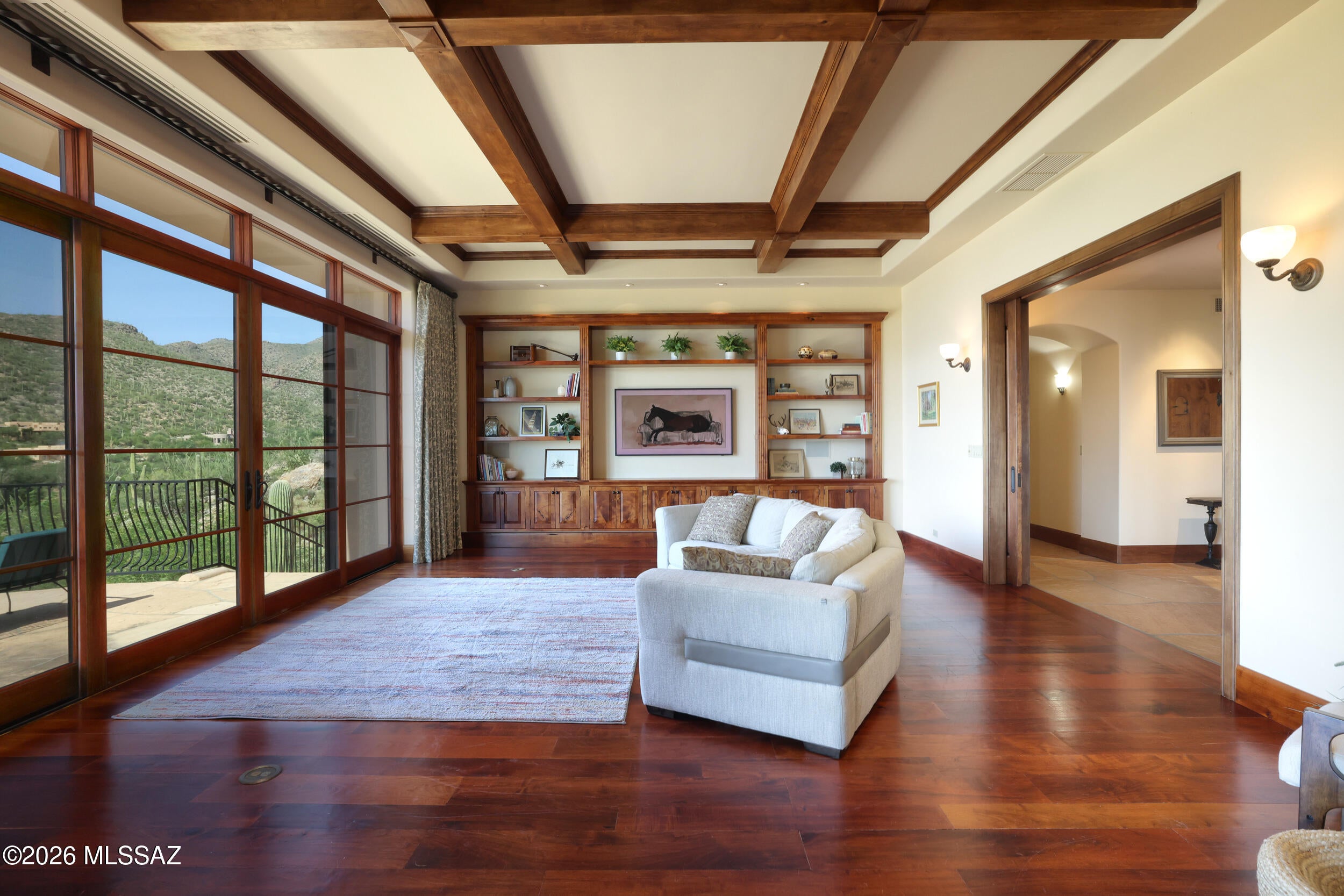Commanding one of Redington Ranch Estates' most spectacular settings, this architect-designed Ron Robinette residence is a masterful expression of Contemporary Southwest luxury. Poised on more than 3 private acres, the 5,027 sq ft Estate showcases Breathtaking Panoramic Mountain & City views through walls of glass that seamlessly connect refined interiors with extraordinary outdoor living. Rich mesquite floors, custom millwork, a Chef's kitchen appointed with a Wolf cooktop, & Luxurious primary suite create an atmosphere of understated Elegance. Expansive flagstone Terraces, dual Spas, Outdoor kitchen, & unforgettable Sunsets complete this exceptional retreat, complemented by exclusive Community Amenities including Equestrian facilities, Clubhouse, Pool, Tennis & Pickleball. Welcome Home!
