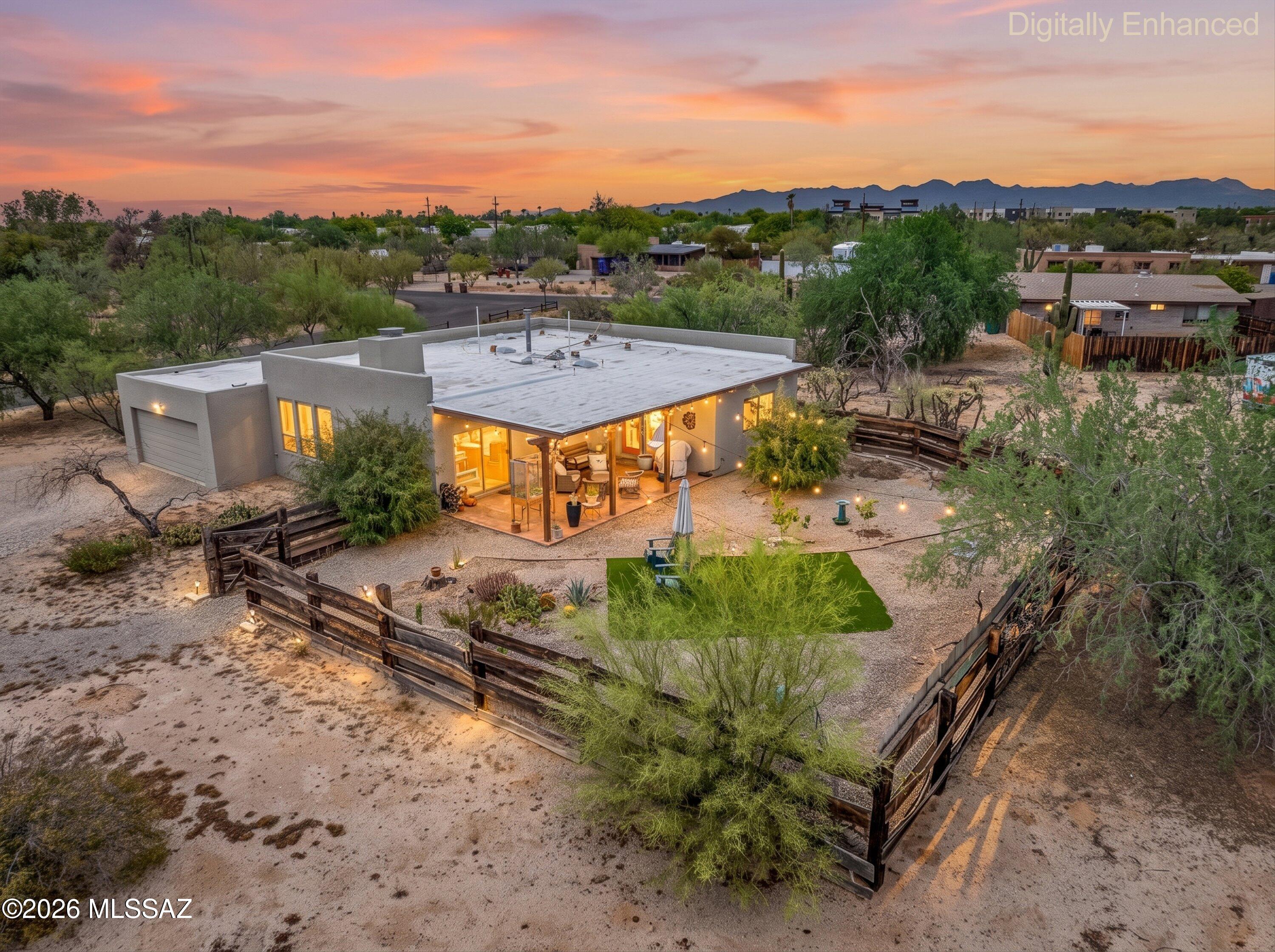 Hidden just minutes from Ina and Thornydale is one of Tucson's best-kept secrets--a private enclave of only seven custom homes that rarely come on the market. Now, one of these exceptional properties is available.  Tucked away on a quiet, unassuming road, you'll arrive at a circular driveway that welcomes you to this beautifully maintained custom home. Nearly an acre of land provides ample space for your RV, boat, trailer, and other recreational toys, with additional parking conveniently located behind the home.
Surrounded by mature desert landscaping, the property offers a peaceful backyard retreat with breathtaking Catalina Mountain views. Inside, you'll find beautiful wood-beamed ceilings, timeless craftsmanship, and a home that has been meticulously cared for. Major updates include a newer roof, HVAC system, and remodeled kitchen cabinets, providing both comfort and peace of mind.
Despite its private setting, this home is just minutes from Interstate 10, Costco, Home Depot, restaurants, shopping, and everyday conveniences--offering the perfect balance of seclusion and accessibility.