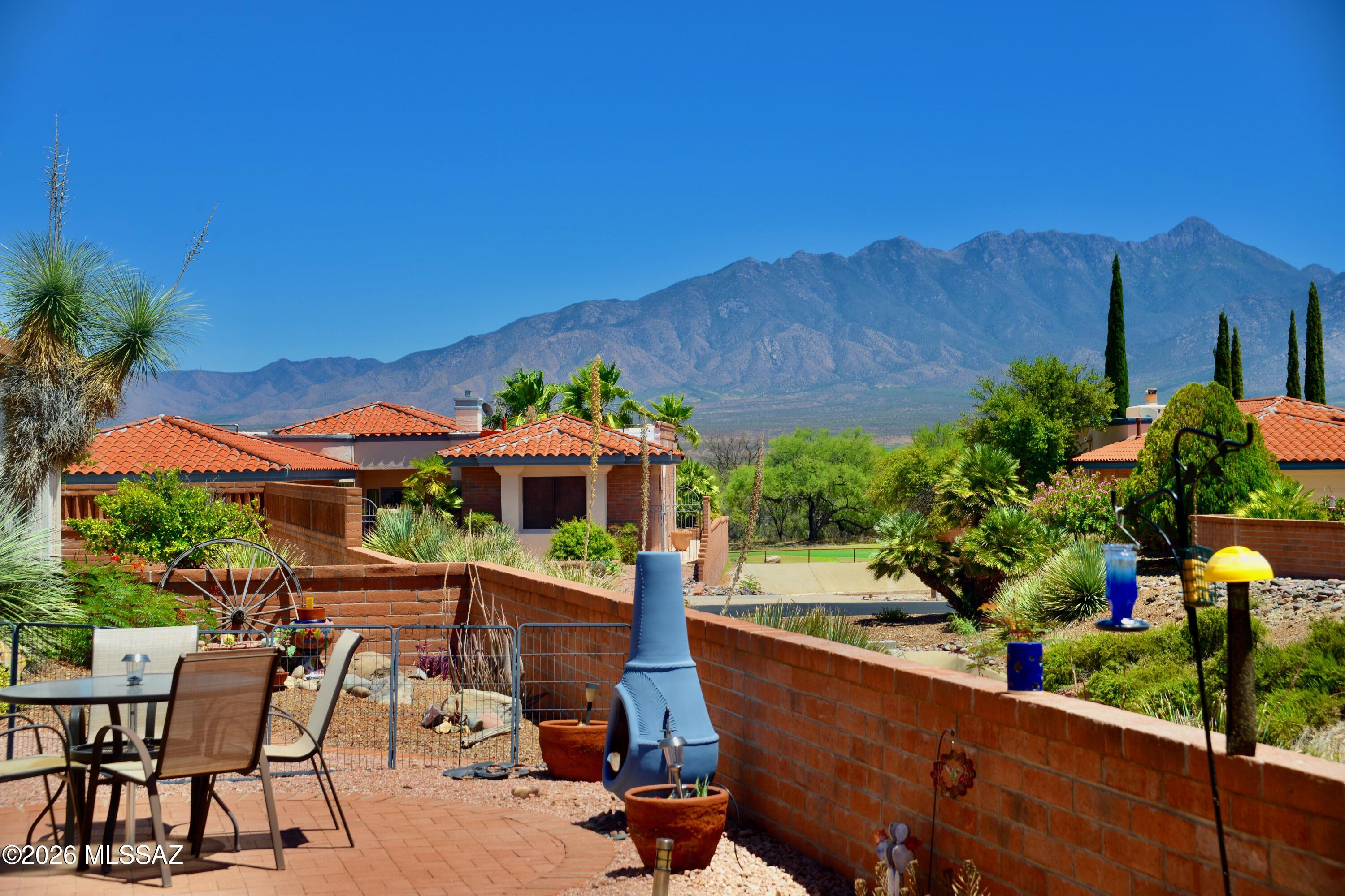 Searching for the perfect home? This beautifully maintained 2 bed, 2 bath home offering 1,291 sf delivers comfort, style, & low-maintenance living with wonderful mountain views & privacy. Updated in all the right places, the kitchen features ss appliances & quartz counters, while both baths offer refreshed vanities, lighting, & modern touches. High ceilings & a solar tube in the living room create natural light & an open feel. Step outside to a paver patio & pergola overlooking the wash to enjoy mountain views, ideal for relaxing or entertaining. Additional features include upgraded plumbing (no poly), 2-car garage with separate storage, electric vehicle charging station, whole-house humidifier, & water softener. A perfect full-time residence, downsizing opportunity, or seasonal retreat.
