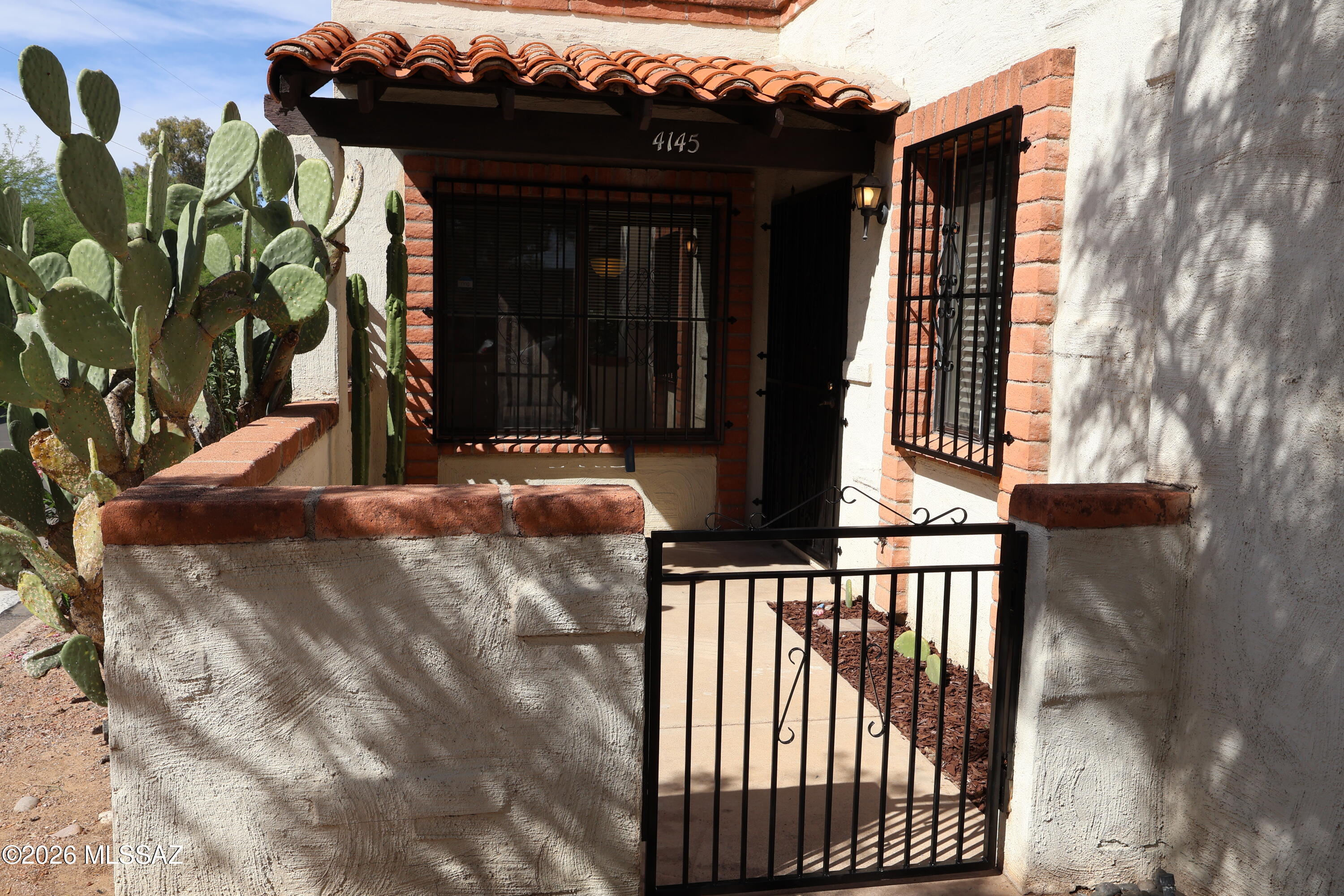 Clean, well-maintained townhome in The Villas is ready for immediate move-in. Located just south of the Mountain River Park Hike-Bike-Walk Loop Path, this friendly community is known for its walkable atmosphere and neighborly feel.

The property features a spacious living room and a functional eat-in kitchen. The primary bedroom includes two separate closets and a large, remodeled shower. Outdoor spaces include covered front and back patios, ideal for gardening or relaxing in the shade. Additionally, the generous carport provides two locked storage areas, one of which includes washer/dryer hookups.

The home is ideally situated just steps from the community pool and offers convenient access to the University of Arizona, the Tucson Mall, many many dining and shopping venues, and I-10 ra This property offers a lovely home or reliable investment opportunity to the new owner. Boasting stucco over solid block construction and a single ownership history for the past 15 years. The interior features tile flooring throughout, with new carpeting in the bedrooms that remains protected under plastic.

Recent improvements include fresh interior paint throughout the home, the carport interior. The facia, sheathing and roof joists under the carport as well as the north side porch have been repainted with Dunn Edwards Eversheild (top shelf paint). While the HOA manages most exterior maintenance, the owner is responsible for the carport, which now features new doors and locksets. The sale will include a significant quantity of replacement paint of the correct colors for the new owner's use.

Please be advised that the correct exterior color is "Cattail #4," which is a custom Dunn-Edwards color on file under their HOA Limberlost Villas color lists. This specific shade is not available in standard color decks. Do not use Sherwin Williams' "Cattail", it is not the correct color.