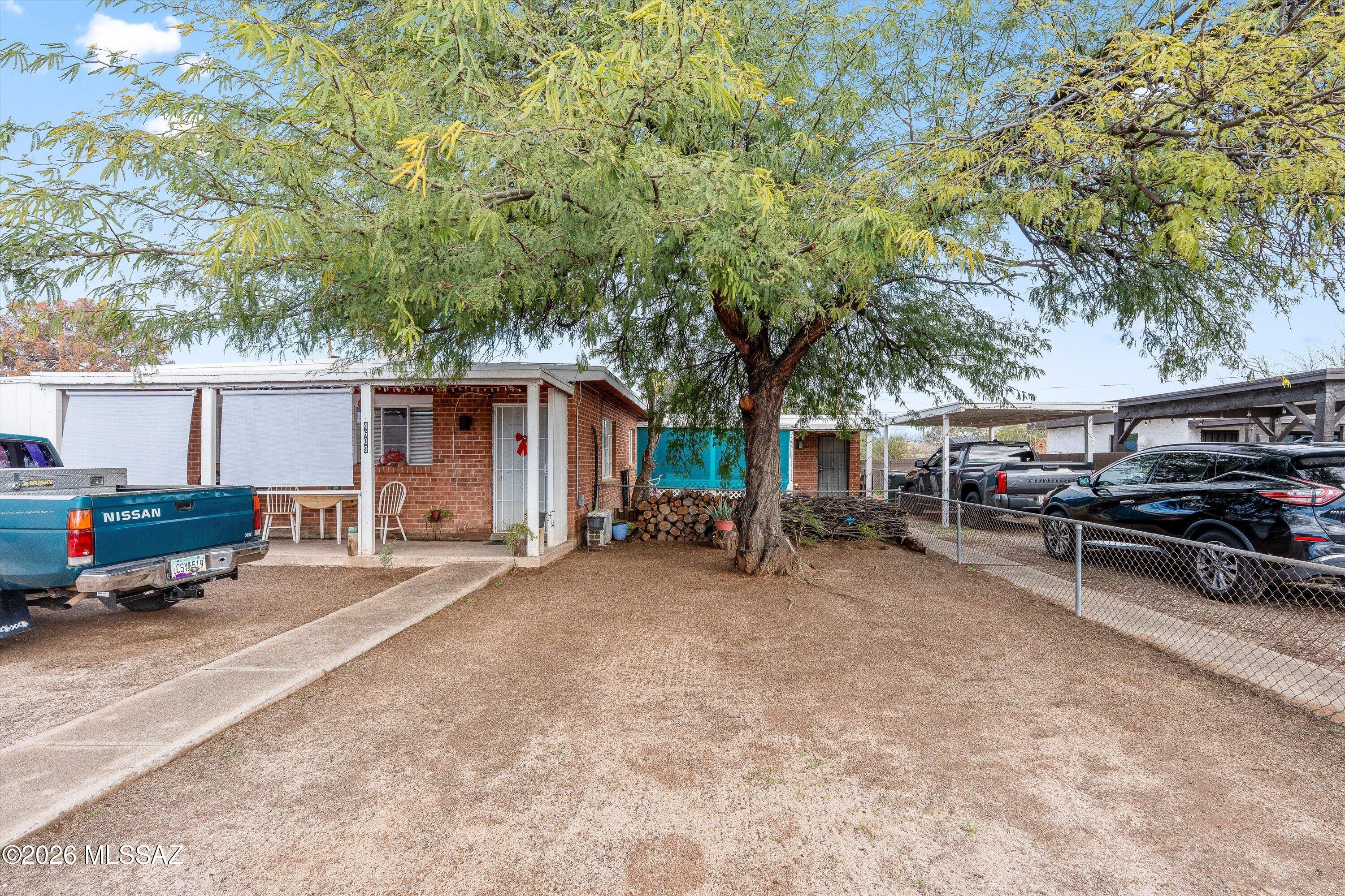 This Red brick duplex in a great location is back on  the market.   2/bedroom and 3 bedroom duplex has a large lot and both units have a yard, including covered parking for 3 cars.  Tenants in 3 bedroom will be moving out any day so showings will be easier.