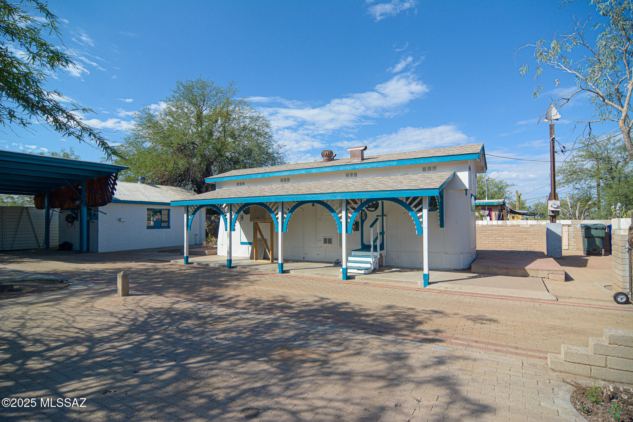 Charming tiny mobile home. On large 6,494 sqft lot. Thousands of square feet of pavers. Block wall surrounds the entire property. Rolling front gate. New roof 2025. New exterior paint. Quiet, dead end street. Close to shopping and entertainment. Minutes from the 1-10. Substantial block workshop with water and power. Cash or seller financing available.