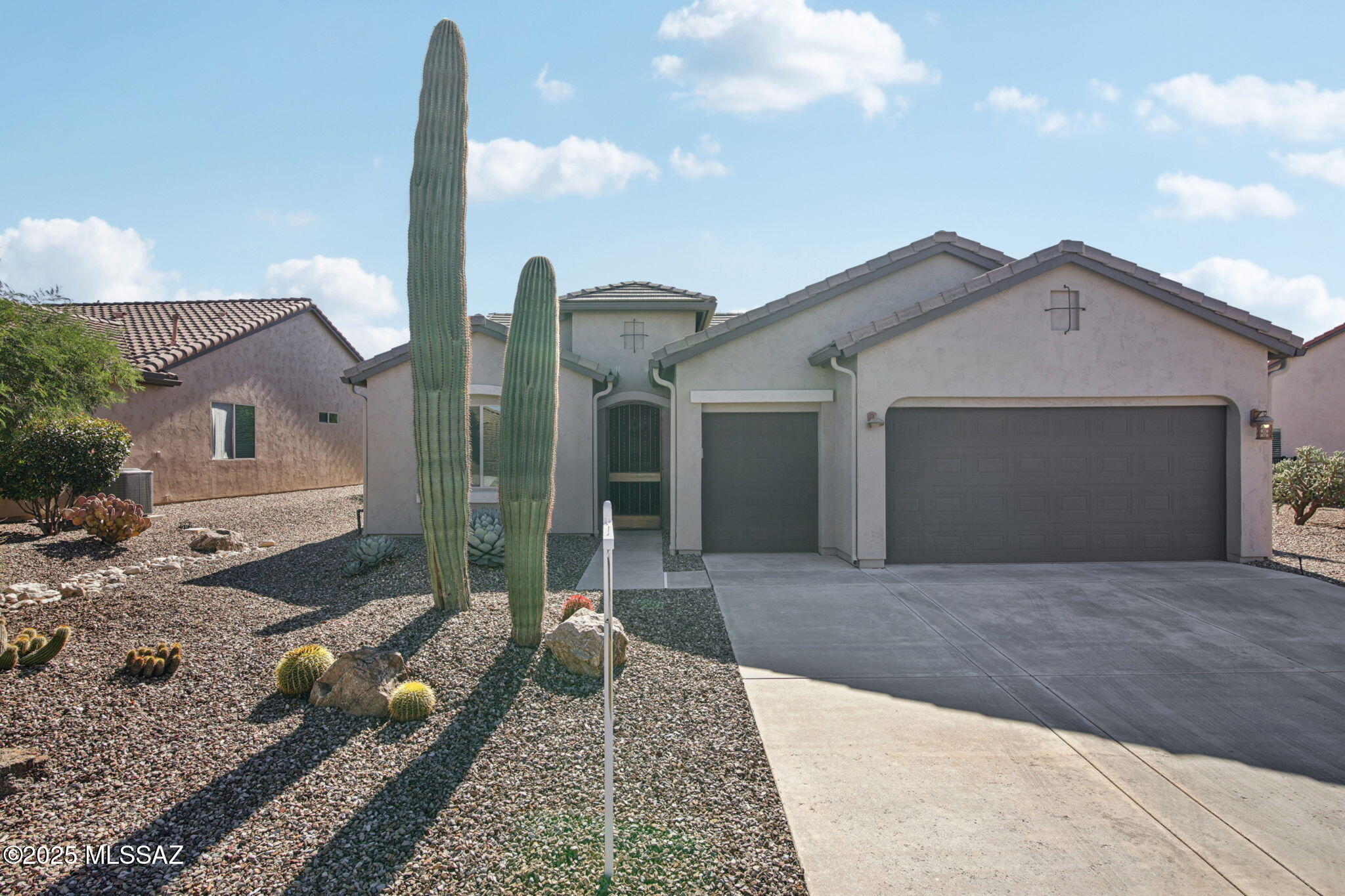 Looking for a designer move-in ready home with an amazing contemporary style? This updated Dolce is for you. Completely remodeled in 2021 from top to bottom. Over $250,000 was spent on the remodel including brand new kitchen with custom double stacked flat panel modern cabinetry, high end appliances including 6 burner Wolf Range, Subzero fridge, Miele dishwasher and microwave drawer.. Leathered granite counters, extended built in bench with storage, and stone tiled backsplash make this kitchen absolutely stunning. New large format porcelain tile floors, paneled accent wall in great room, and steel/glass double doors leading to the office/den. Primary suite includes an updated bath with floating vanity, undercabinet lighting, huge walk in shower, mirrors with led lights, and custom walk-in closet. The enclosed patio with two accordion style screens allows for a huge, expanded living area to be enjoyed year-round. Wonderful indoor/outdoor living with common area behind home plus extended brick paver patio and low care landscaping provide a wonderful backyard setting and privacy. Custom front door and security screens for added security are perfect to lock and leave. Too many upgrades to list...see attached features list. This home has been thoughtfully updated and will not disappoint.