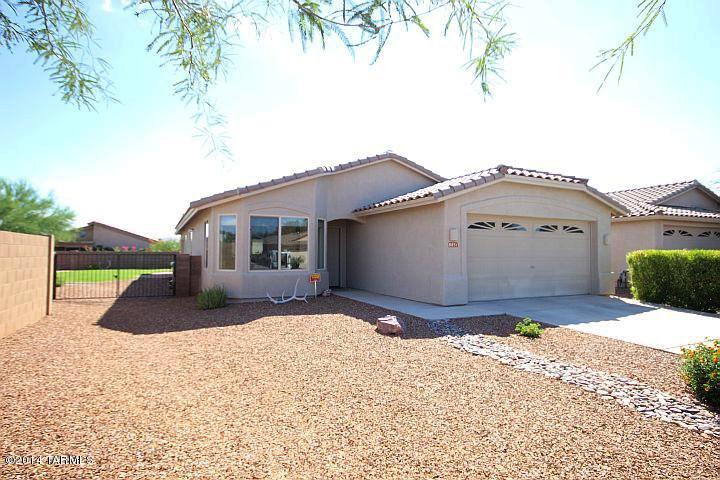 WOW! Lovely 3BR/2BA home in desirable Bluffs. Primary suite with sitting room, currently used as home office. Recessed lighting, spot lights for your paintings, ceiling fans, dedicated electric for freezer, workbench & outdoor Christmas lights. Tile floors throughout & carpeted bedrooms. Over sized premium lot with grass area in the backyard & irrigation system. Enjoy relaxing on the covered porch and take in the beautiful mountain view. Lovely community park with basketball court, baseball diamond, playground & ramada.