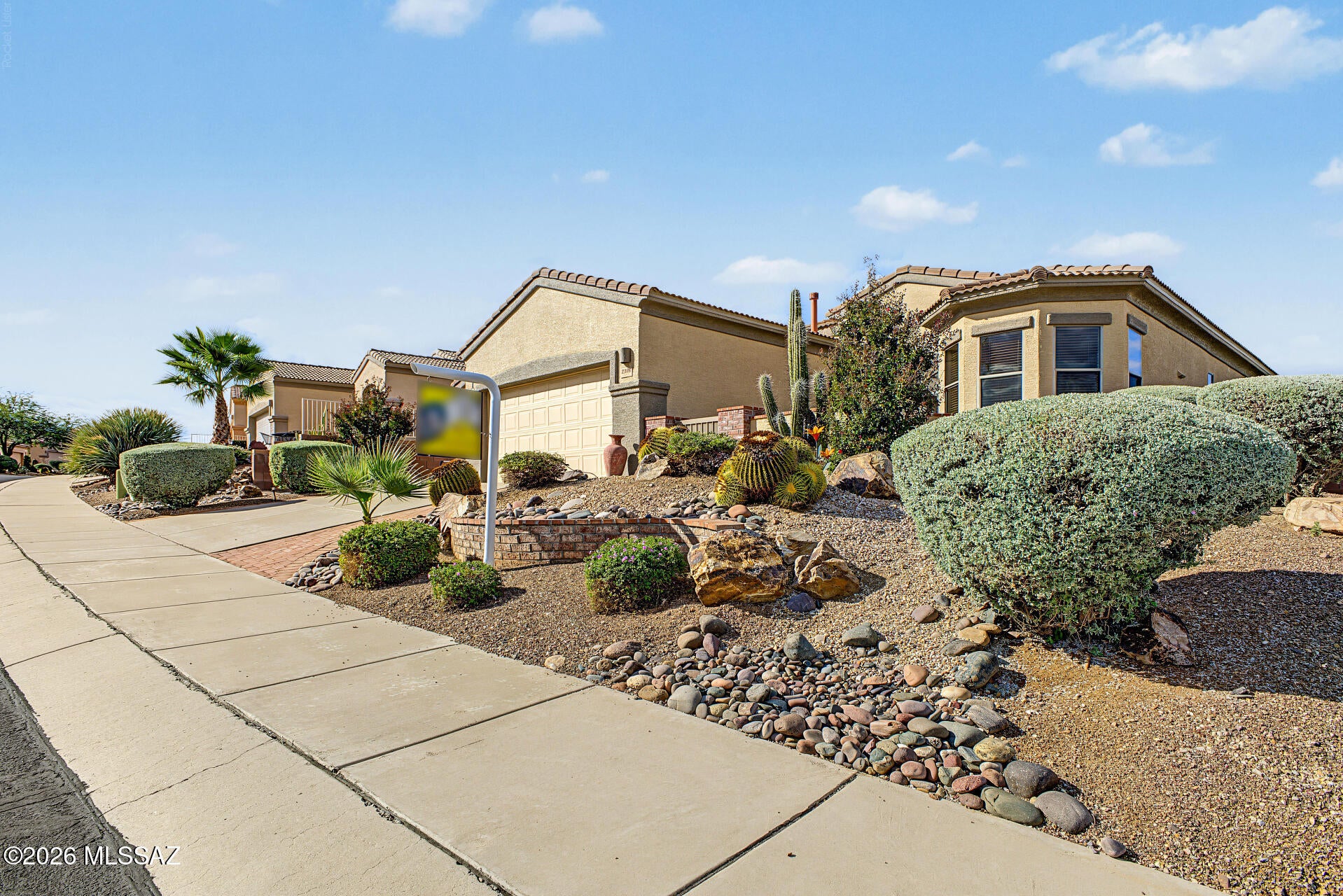 Be at home in this beautiful Canoa Northwest home that has magnificent Santa Rita views. From the lovely front landscaped yard with patio through the 10' entry doors, that let you emerge into an open bright floor plan. You'll be amazed at the crisp quartz countertops, new SS GE appliances and wood look tile floors. The Primary has a double sink vanity  with walk in shower, walk-in  closet plus an extra one! Beveled glass doors off the living room escort you out to the peaceful backyard with large covered patio, drip system and water feature and there 
are colorful plants galore. Bring your golf cart to this 2+ garage. Water softener is a Plus! Don't miss this one! Great home Great Price