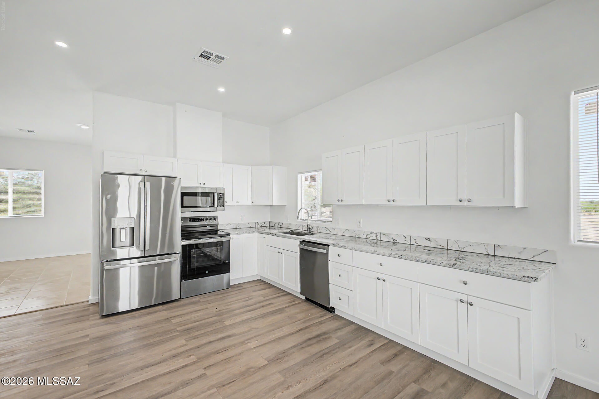 Fantastic opportunity to own this new construction single-level residence on a sprawling 1-acre lot! You'll be delighted by the inviting living room with high ceilings, recessed lighting, a soothing palette, blinds, and durable tile flooring. The spacious eat-in kitchen comes with granite counters, white shaker cabinetry, and sleek stainless steel appliances for a delightful culinary experience. The tranquil primary bedroom showcases a private bathroom with dual sinks and a walk-in closet. Venture out onto the vast backyard, which features a covered patio and majestic mountain views that provide a picturesque backdrop. Plenty of room to add an RV garage, carport or workshop!