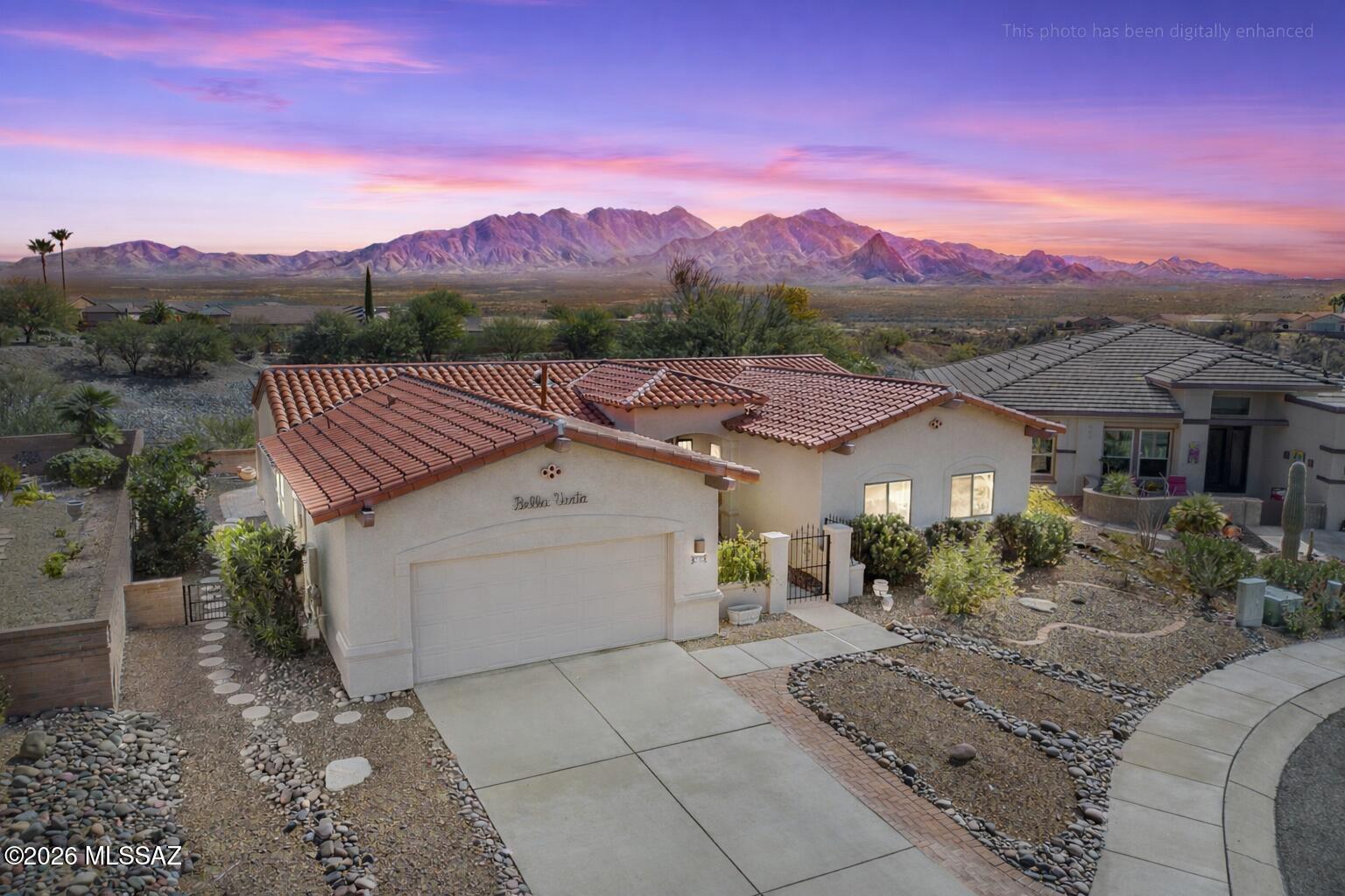 Bella Vista (Green Valley AZ 85622) in gated San Ignacio Vistas II offers panoramic Santa Rita Mountain views in a Mediterranean-inspired desert setting. Custom wrought-iron details and distinctive brass, ship-inspired accents add character throughout. Light-filled living areas frame wide-open desert vistas for unforgettable sunrises and sunsets. Tile roof, gas available, and furnishings may be available for a seamless, turnkey move. Classic Southwest architecture with a story you'll want to see in person.