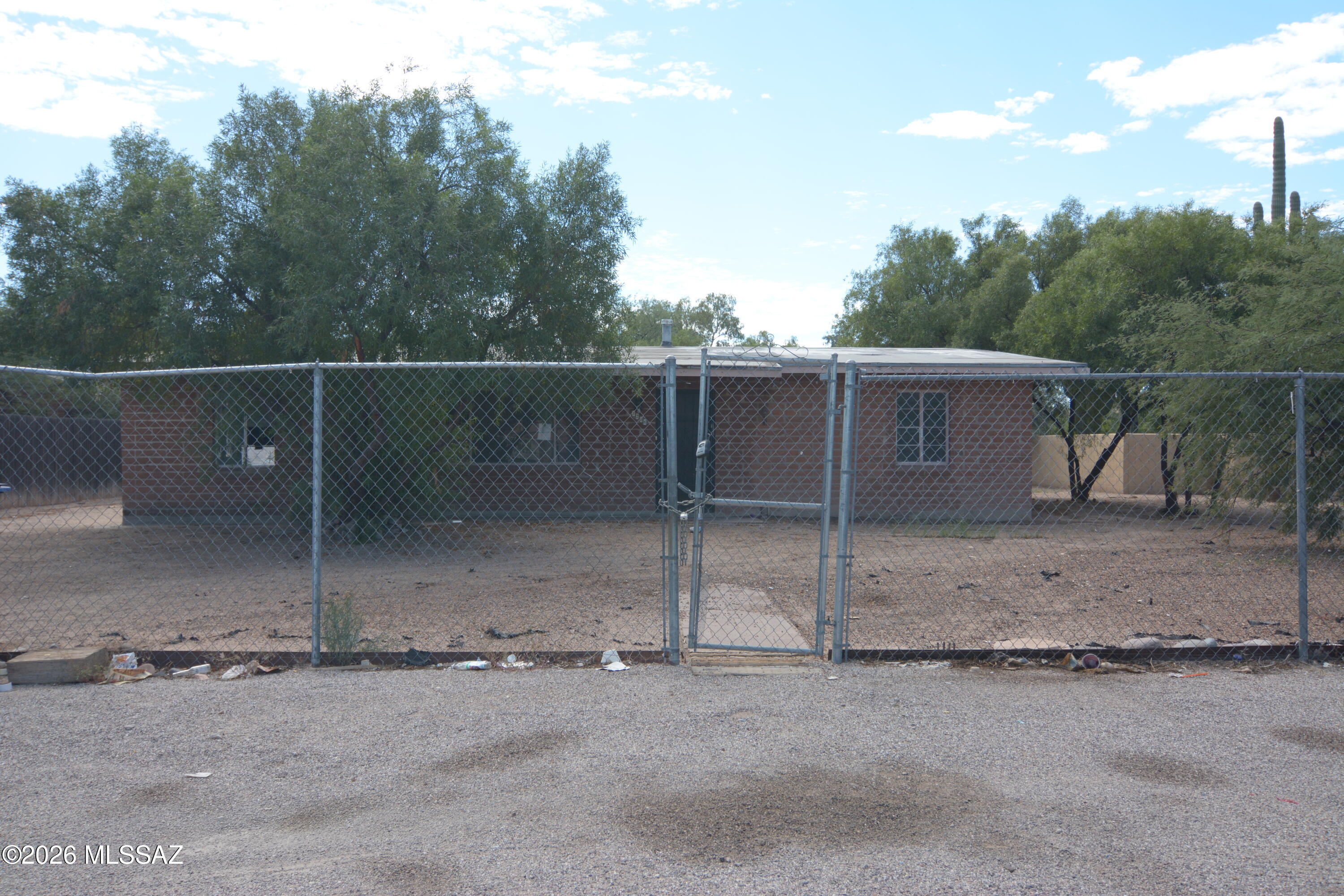 Large lot located in a convenient South Tucson location. Property is in need of TLC.  Lots of room to build additional units.