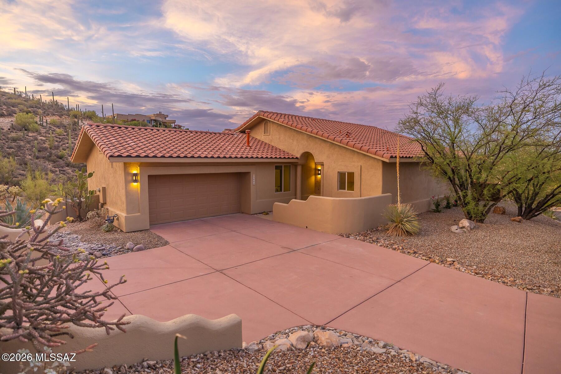 Elegantly perched above the Tucson Valley, this stunning Starr Pass renovation  offers an exceptional opportunity. Stunning new Contemporary interior thoroughly re-designed w/ Modern kitchen, designer flooring & luxurious spa-inspired bathrooms, all by Next-Level Remodels, LLC. Spectacular backyard is an entertainer's dream, featuring Quartzite covered BBQ island & striking rusted steel fence. Beautifully designed outdoor spaces w/ built-in fire-pit, planter beds & elevated seating, providing endless views of sparkling city lights & majestic mountain ranges. Comprehensive improvements include new Roof, HVAC, Appliances, etc. Come experience this rare blend of modern design & stunning, elevated Desert setting, minutes from U of A campus, Downtown Tucson plus Starr Pass Golf & Fitness.