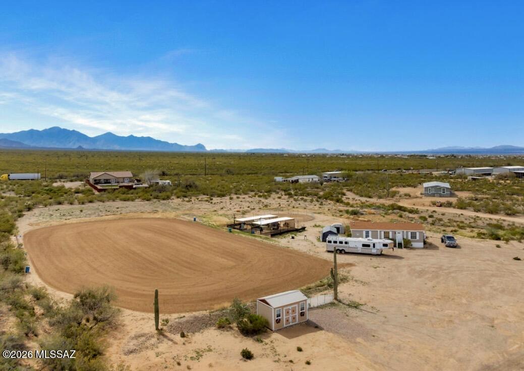 Location Plus! A rare hard to find turnkey Horse Property with an amazing convenient location that isn't in the middle of nowhere like most! Perfect location with 4.1 acres on a quiet street with only 3 neighboring properties & no HOA. This 3 bedroom/2 bath open concept home , newer floors, wall fixtures,  newer AC  unit. This charming property is nestled a couple minutes from Vail a couple minutes from Sahuarita-right in the middle of the two towns! And a very short distance from the Pima County fairgrounds and also downtown Tucson. Tool and storage shed located between the barn and the home with a building for tools, saddles, etc. and there is more as an additional plus is the regularly groomed 150x260 Horse arena.
See supplement for even more amazing features... 10x20 shelter, logic structure new only three months old with metal frame used as outdoor movie theater with electric leather recliners and propane fireplace for those relaxing Arizona evenings.The barn features four stalls with alley way and water into every stall-plus every stall is equipped with misters! The stalls are 20x20 with a nice round pen with motion lights. Dog kennel rear of the house, 5 foot chain-link fence running the whole length of the house. You will appreciate the Kennel owners adding extra mesh fencing at the bottom to keep out poisonous snakes and frogs.
20x12 completely finished shed with electricity, water, AC unit, awesome multipurpose building with gravel driveway to house  and shed.

This special property with great location won't last long and is ready for quick close!!!