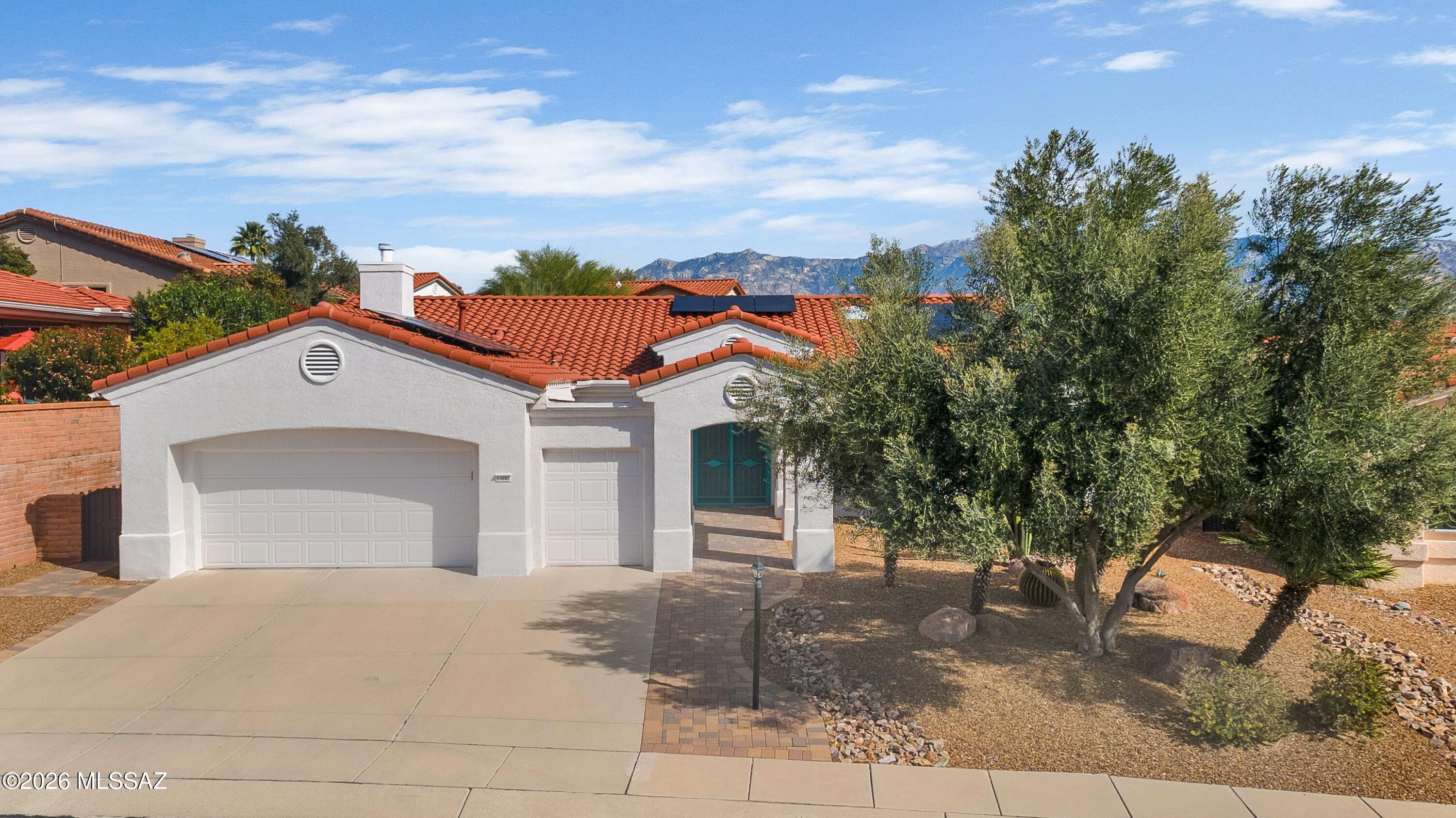 Welcome Home! This highly sought-after Regent model offers 2,447 sq. ft., featuring 2 bedrooms, 2.5 bathrooms, a den, and a bonus room--plenty of space to live, relax, and entertain. Nestled on a quiet cul-de-sac, this home provides privacy and tranquility.  Step through the elegant double-door entry into the formal living and dining areas, perfect for entertaining. The inviting great room features a gas fireplace and a built-in entertainment center.  The gourmet kitchen includes stainless steel appliances, a gas cooktop, granite countertops with custom backsplash, and a center island with seating.  The generous primary suite includes a sliding glass door to the patio, a cozy bay window, an expansive walk-in closet, and a spacious walk-in shower. The second bathroom has been recently upgraded as well.  Enjoy outdoor living in the private backyard, complete with an extended paver patio, ramada, and beautiful mountain views. There is a generous amount of storage throughout the home, including an extended garage.  Additional upgrades include owned solar, tile and engineered wood flooring throughout (no carpet), plantation shutters and so much more!   Explore the Sun City lifestyle that includes a state-of-the-art fitness center, 2 swimming pools, golf, pickleball courts, tennis courts, and an abundance of activities.