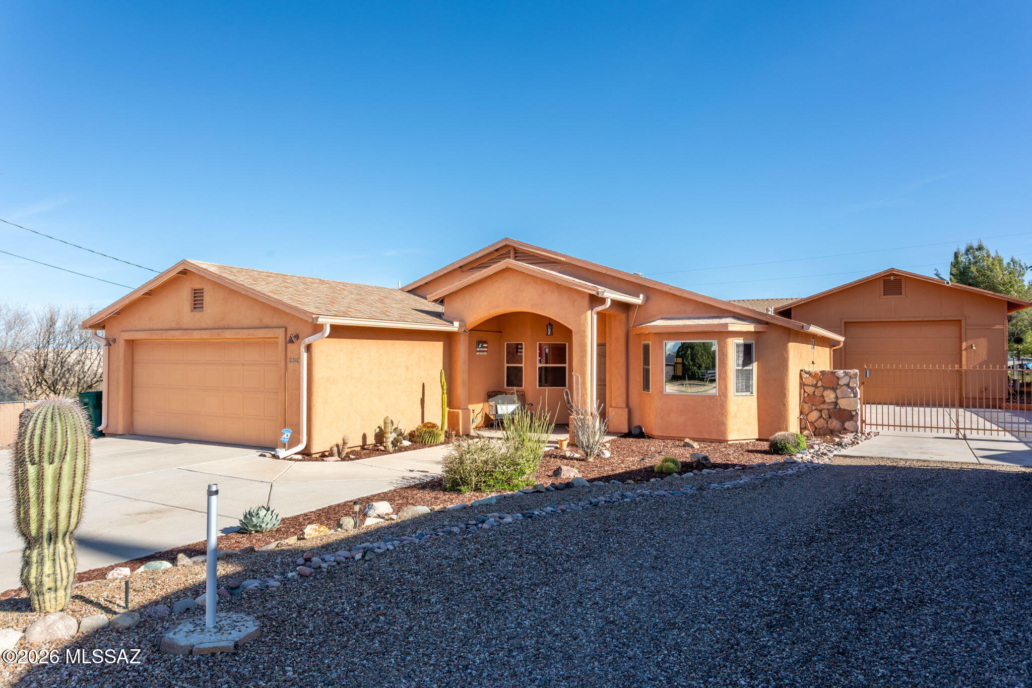 Rare find 3 bed/2 bath single story home on large lot with huge custom built RV garage & workshop. Well maintained, offers quality, and many amenities you have been looking for! Spacious open great room with soaring vaulted ceilings and warm wood burning stove. Additional natural light from solar tubes.  Kitchen offers expansive countertops, newer upgraded appliances. Split bedroom floorplan, large master retreat.  French doors in great room leading out to the cozy covered porch added privacy walls. Backyard accented with beautiful rock wall an additional side yard which add to the serenity. Double gate to rear yard gives room for your toys: boat or RV, an incredible amount of extra parking. Cooler temperatures in Oracle Come and enjoy a small-town lifestyle. This home will be hard to be