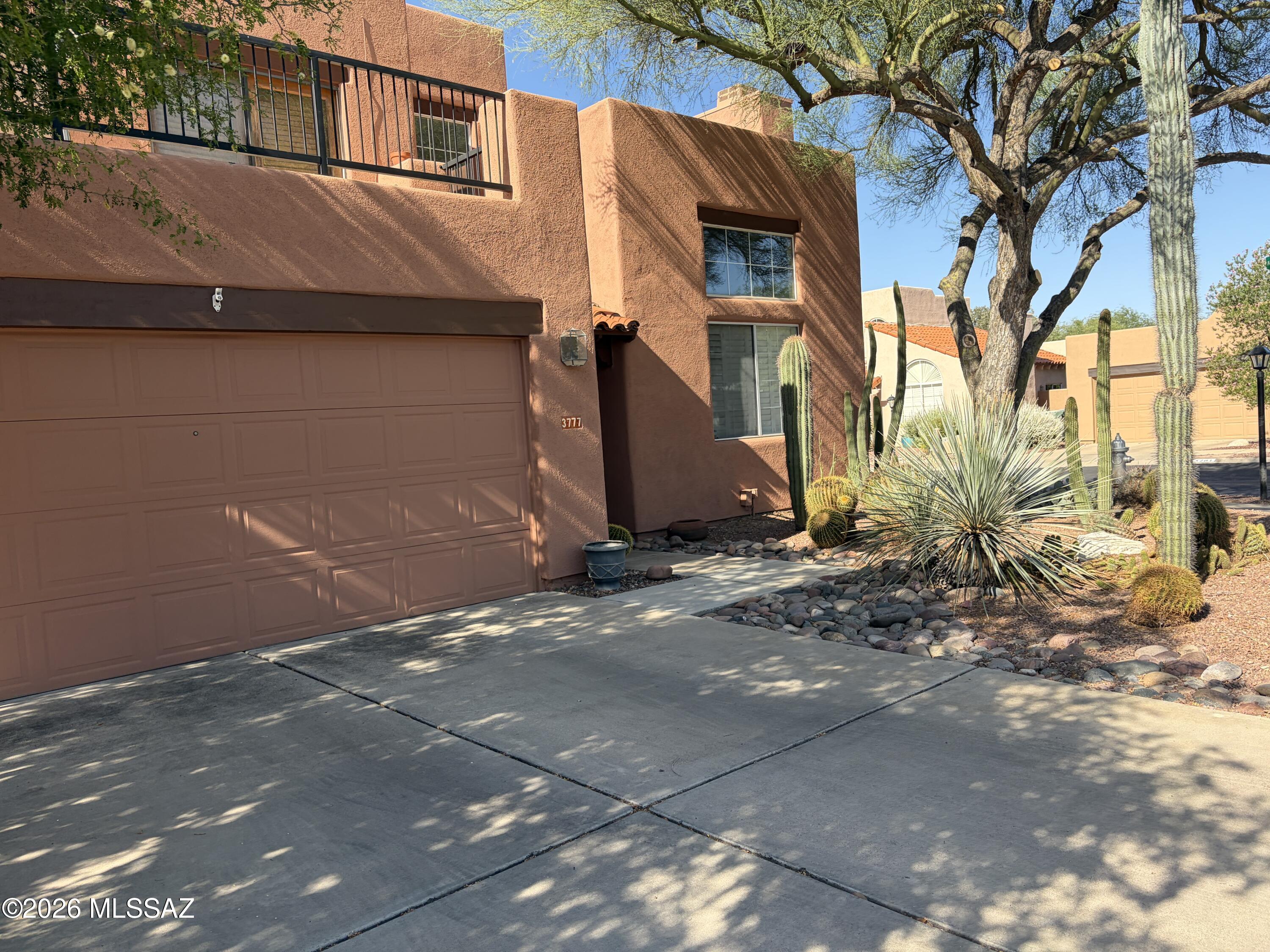 This quality-built 3-bedroom, 2-bathroom home delivers the perfect blend of Southwest charm and modern comfort. Located in a quiet, highly desirable enclave, the property puts you minutes from the Riverwalk, the Tucson Racquet & Fitness Club, and premier local shopping and dining. Inside, the cook's kitchen features stainless steel appliances and flows seamlessly into open living spaces detailed with ceramic tile flooring and elegant plantation shutters. The main bedroom serves as a scenic retreat with beautiful mountain views and a luxurious en-suite bathroom featuring a jetted garden tub. Step outside to an expansive tiled patio overlooking a stunning, low-maintenance cactus garden. It is your own private oasis of peace and serenity, alive with the sound of singing birds.