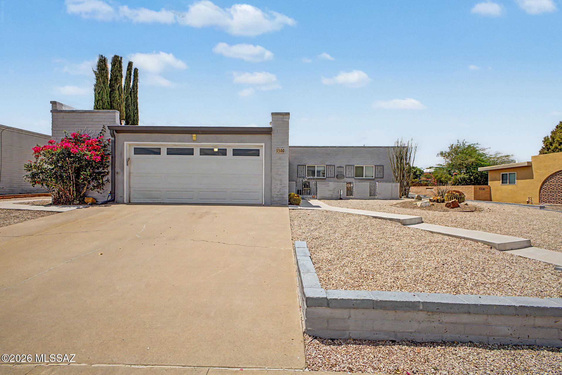 Remodeled, slump block gem! This adorable single-story home welcomes you with a manicured landscape and a 2-car garage. Interior showcases a spacious layout with new tile flooring, contemporary lighting, newer windows, a neutral palette, & plenty of natural light. The remodeled kitchen is complete w/ ample cabinetry adorned w/ crown molding, elegant quartz countertops, backsplash, gas cooking & stainless steel appliances. The main suite is spacious & offers, tile floors, a private remodeled bathrm & walk-in closet. Out back, you'll have plenty of space for entertaining, relaxation, & storage, w/ a covered patio ideal for casual dining, ample seating space w/ pavers, artificial turf, & a storage shed. Decorative fireplace stays. Newer hot water heater. All appliances in kitchen stay. Low HO Washer and dryer stay too.  Plantation shutters, fans in bedrooms, remodeled bathrooms, fans in bedrooms.  Great solar lease plan with low utility bills.  The entire home shows like new and in excellent condition.  Move-in ready! Low HOA fees per month! Walking distance to GVR pool, Desert Meadows Park, and De Anza Trail.