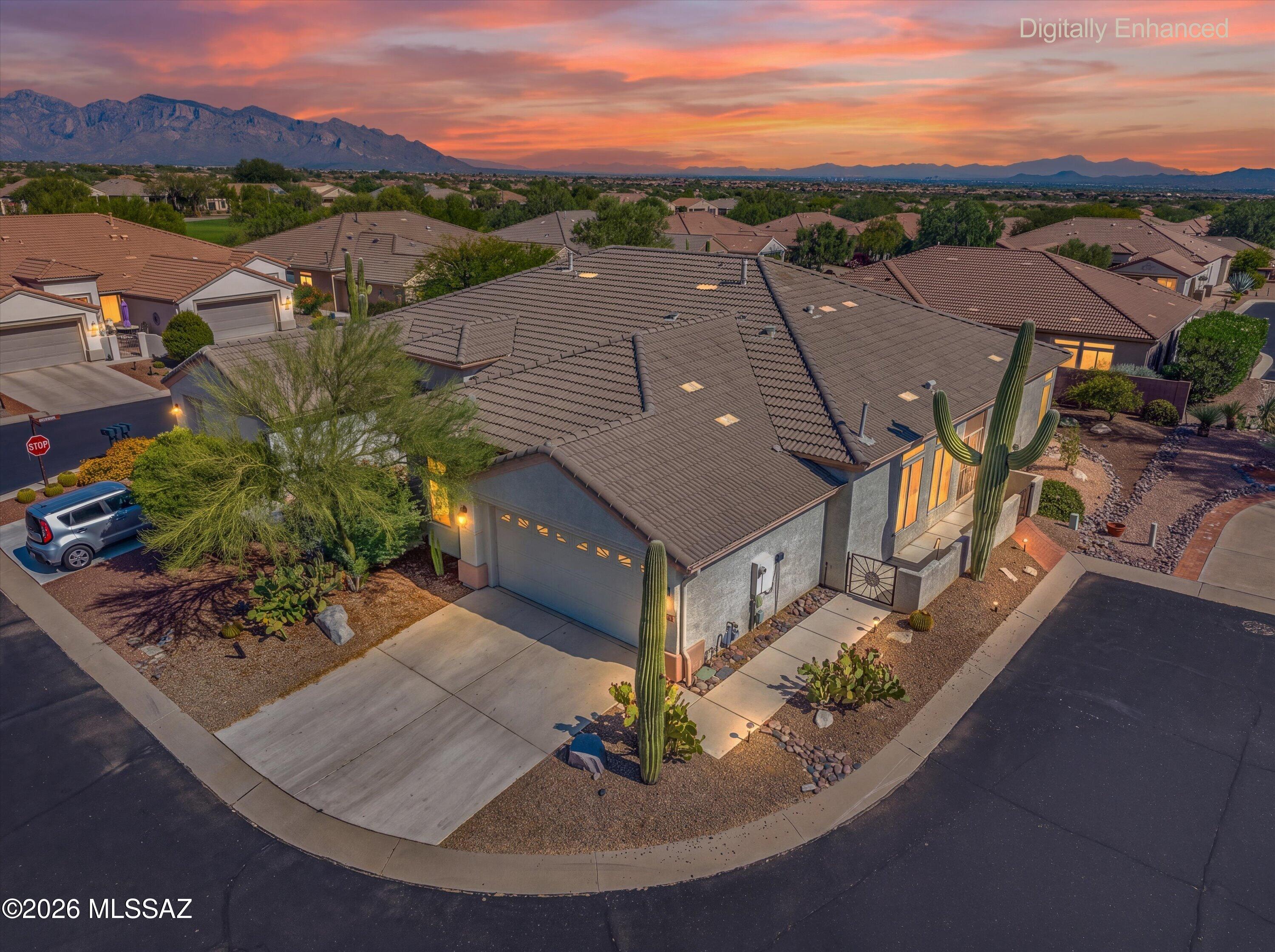 Welcome to the Highlands at Dove Mountain, a premier active adult community! This fully furnished 2-bedroom, 2-bath Conquistador model offers 1,679 sq. ft. of comfortable living and is an exceptional value. Located at the end of a quiet cul-de-sac, the home features a spacious kitchen with abundant cabinetry, and generous counter space. The great room opens to an extended paver patio with landscape lighting and a mature orange tree. Additional highlights include oversized bedrooms, a bay window in the guest bedroom, tile flooring throughout most of the home, and an older but fully operational HVAC system. Enjoy resort-style amenities including golf, pickleball, tennis, fitness center, pool, and countless clubs.