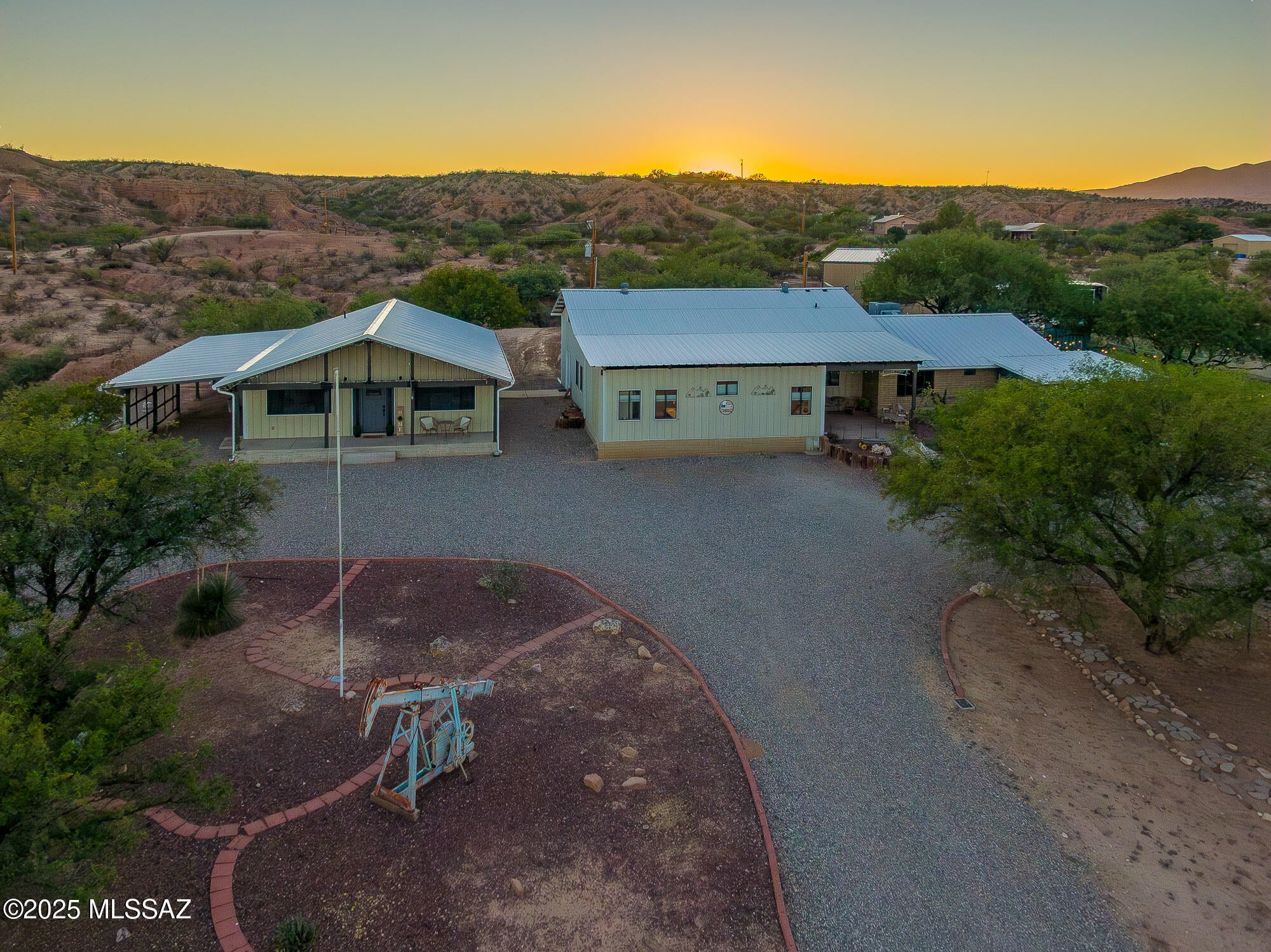 *Motivated Seller* Welcome to a truly exceptional multi-Family compound set in the beautiful San Pedro Valley. This private, expansive estate spans 25.58 fenced acres, including two homes and a private well. The main modernized residence features 6 bedrooms and 4 baths while providing ample space with three distinct living areas and a formal dining room. The master suite offers a private entry, and a spa inspired bathroom. The 2-bedroom, 2 bath Casita boasts modern luxury with vaulted ceilings, granite countertops throughout and a large climate-controlled walk-in pantry. A massive 45x60 metal shop is perfect for all your toys, farm equipment or event venue. Casita and Shop built in 2023 Equestrian amenities include a 50x30 barn with stalls and a tack room. Only 7 minutes from Wal-Mart, 30 minutes from Tucson. This amazing property offers limitless opportunity for generational living, rental income, event hosting or anything your imagination can dream up.