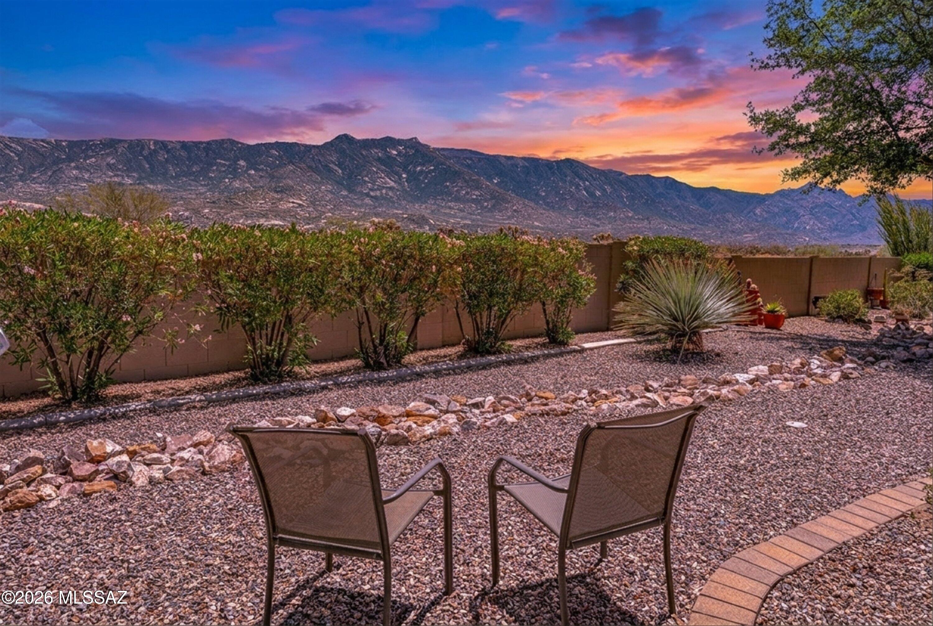Experience true lock-and-go living in this turnkey Capri Villa. The living room offers a welcoming ambiance enhanced by picturesque mountain views and flows seamlessly to a spacious dining area enhanced by a transom window, creating a bright and airy atmosphere. The well-designed kitchen is both open and functional, providing ample cabinetry and a pantry closet. A bay window in the breakfast area highlights mountain vistas and grants convenient access to the covered patio. The expansive primary suite features a walk-in closet for abundant storage, a double vanity, and a tile shower. The guest room also serves as a versatile den and offers easy access to the hall bath for added convenience. Outdoors, unobstructed mountain views can be enjoyed from both the covered patio and the extended exterior space. Embrace the SaddleBrooke lifestyle with this exceptional residence.