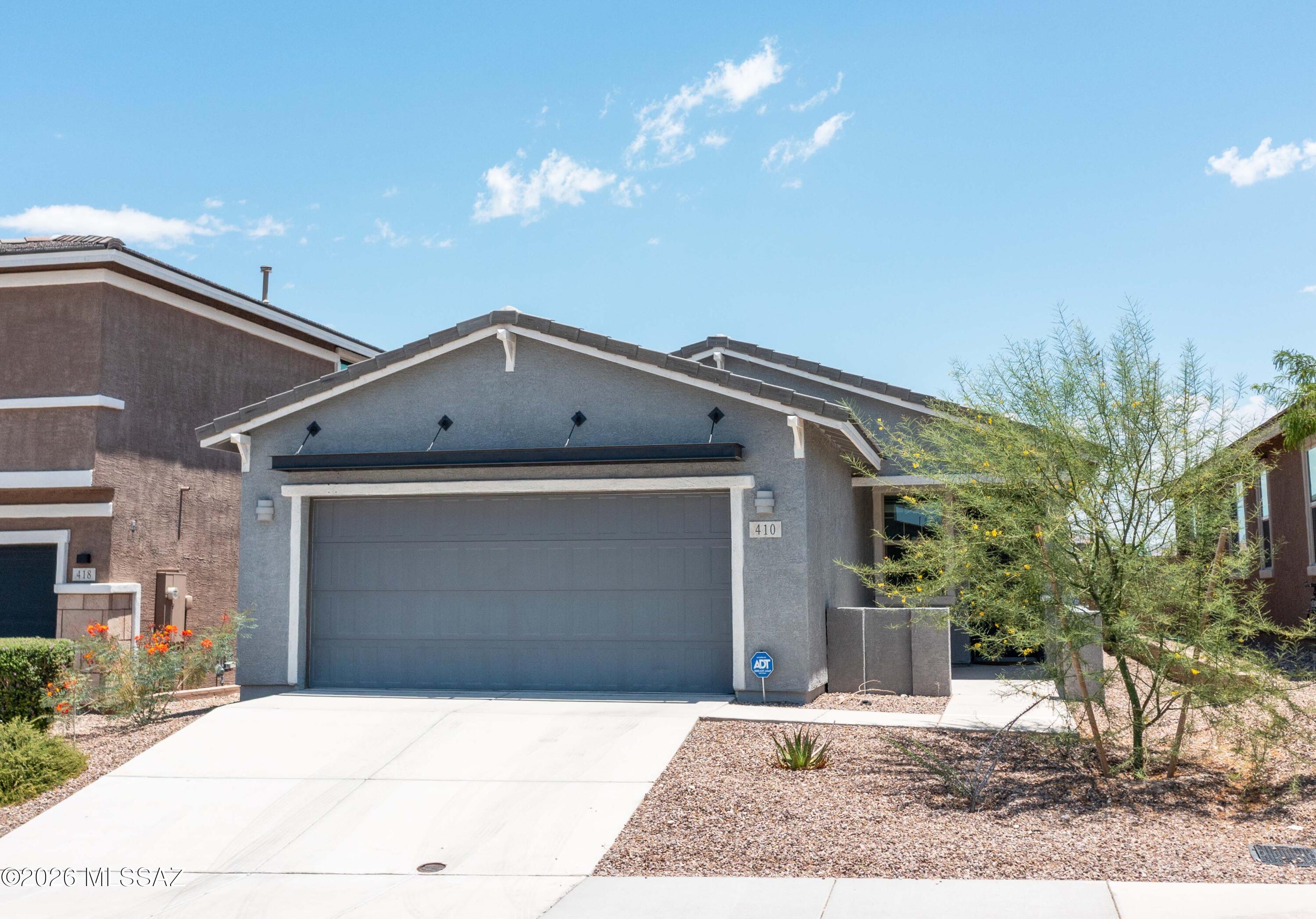 This beautiful Meritage home has an open floor plan, split bedrooms and tons of natural light.  Sitting deeper in the community the home offers an east facing yard with fabulous views of both the Catalina and Rincon Mountains.  Inside you'll find a versatile office/den space that offers privacy from the rest of the home.  The kitchen has all stainless steel appliances, granite countertops and an island suitable for the active chef. The great room allows for comfort and active living inside that can spill out into the yard.  Decorative rock covers the back yard allowing you to create your own paradise while looking at mountains and open desert space.  Home is close to shopping, movie theater and many other amenities.