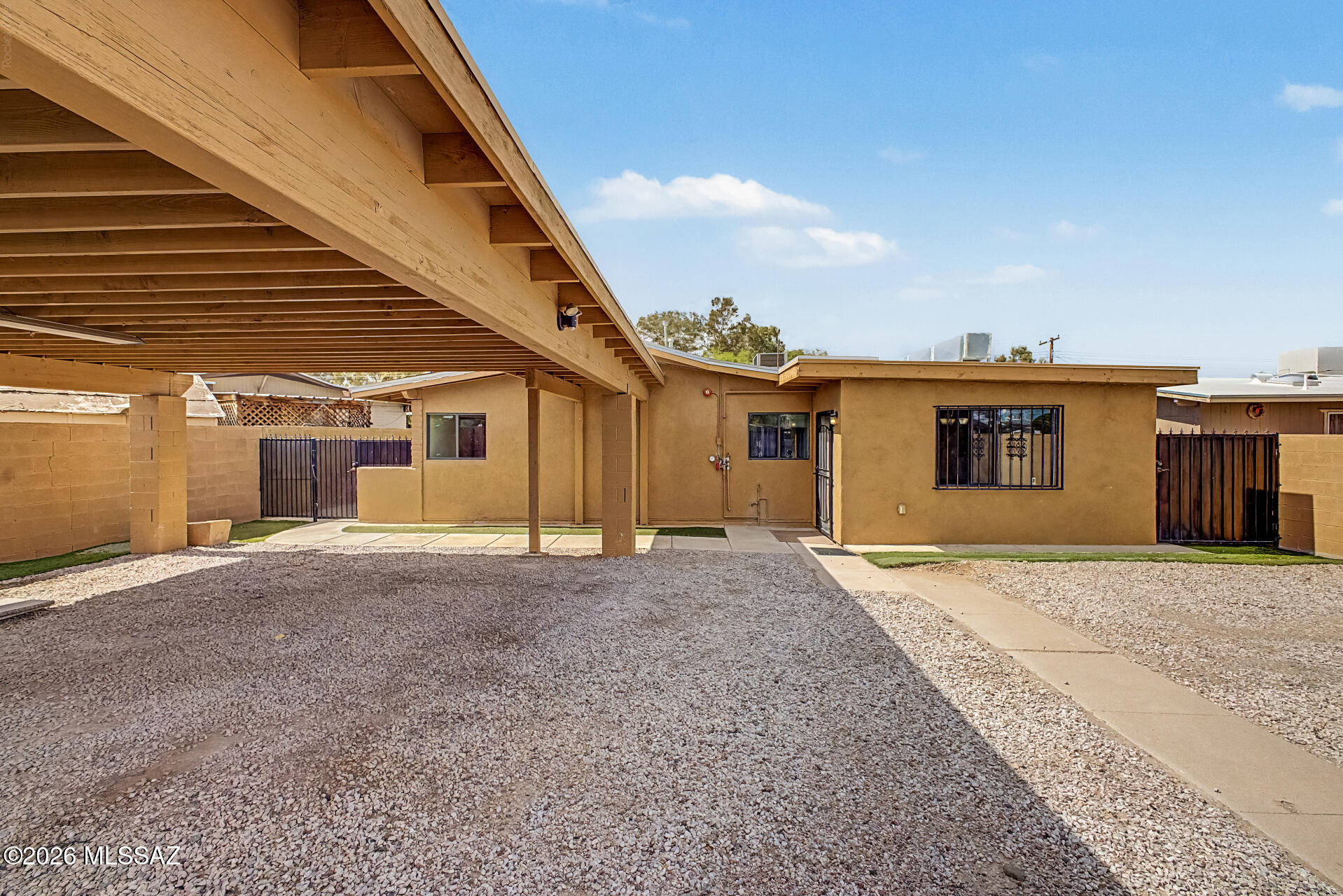 Rare 7-bedroom, 3-bathroom opportunity in central Tucson offering exceptional flexibility for investors, operators, or buyers needing a spacious home with multiple private rooms. The property features generous common living areas, tile flooring throughout, fresh interior paint, and upgraded bathrooms. The renovated kitchen includes white cabinetry, ample counter space, and stainless steel appliances. A major value-add is the City of Tucson Certificate of Occupancy, which may be beneficial for buyers exploring residential care, behavioral health, adult care, or similar residential use opportunities, subject to buyer verification and any required approvals. The home is fully gated in both the front and back for added privacy and includes an automatic gate, covered patio, storage shed, and detached rear ADU for additional versatility. Conveniently located near Reid Park, golf, restaurants, shopping, and central Tucson amenities, this is a unique property with space, privacy, and multiple potential use cases rarely found in this location. These opportunities do not come around often, schedule your showing today.