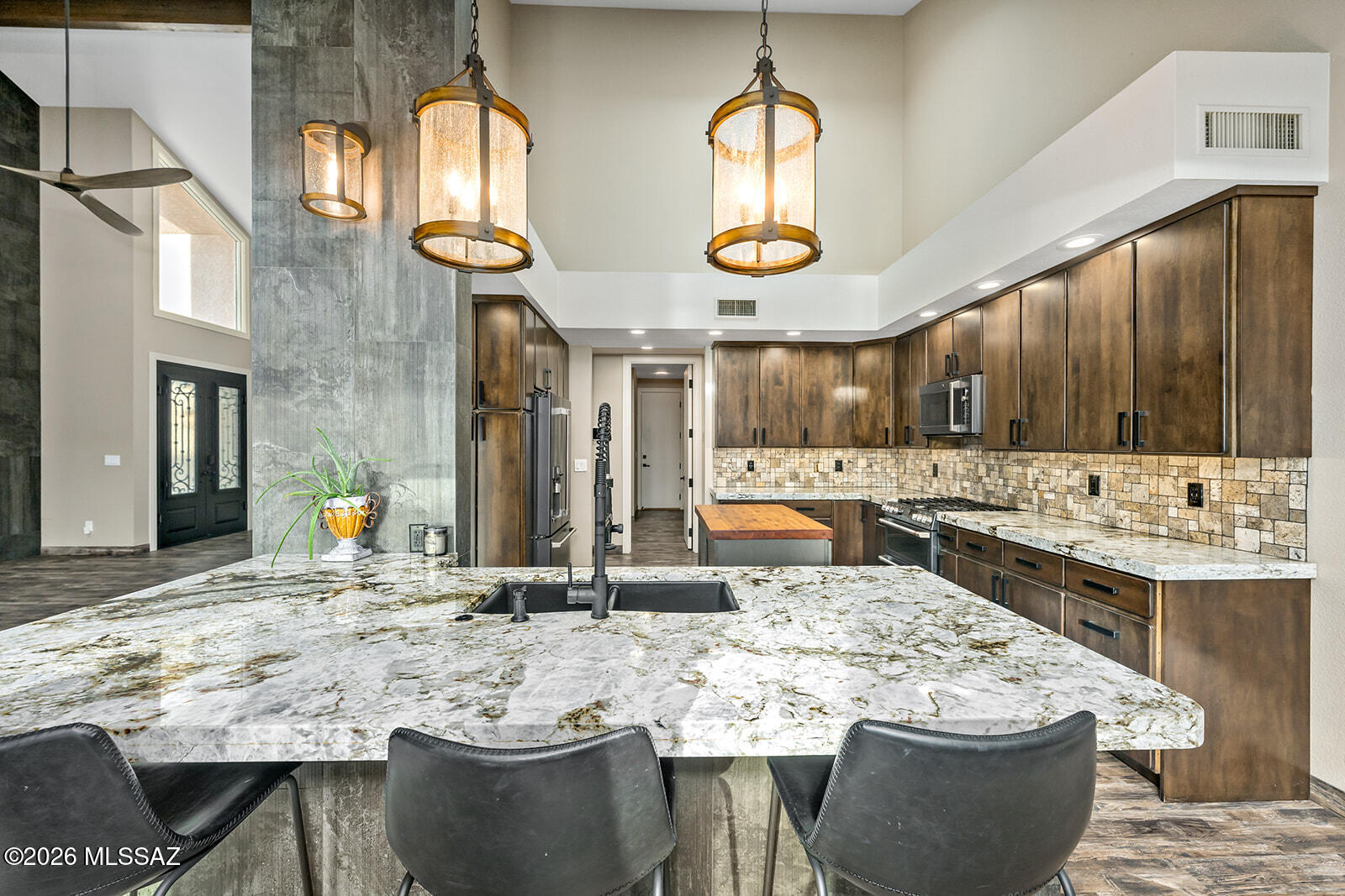 Experience elevated desert living in the prestigious Omni Tucson National Resort community, perfectly situated along beautiful Hole 15 on the Sonoran golf course. This completely reimagined townhome has been exquisitely redesigned by Kelch Custom Homes with exceptional craftsmanship and thoughtful attention to every detail. Offering 3 spacious bedrooms and 3 full bathrooms.
The newly expanded primary suite creates a private retreat. Designed for true Arizona indoor-outdoor living, featuring a custom spool with waterfall feature, built-in barbecue, mini refrigerator,  beautifully finished paver landscaping both the front and back of the home. Experience elevated desert living in the prestigious Omni Tucson National Resort community, perfectly situated along beautiful Hole 15 on the Sonoran golf course. This completely reimagined townhome has been exquisitely redesigned by Kelch Custom Homes with exceptional craftsmanship and thoughtful attention to every detail.

Offering 3 spacious bedrooms and 3 full bathrooms. 
The newly expanded primary suite creates a private retreat that opens into the resort-style backyard.  
Designed for true Arizona indoor-outdoor living, featuring a custom  spool with waterfall feature, built-in barbecue, mini refrigerator, and pavers that flow from the front to the back of the home. Every space has been immaculately maintained and curated for both entertaining and relaxation.

Additional highlights include - Expanded living space in secondary room with added private entry for guest. 
2 new sliding glass doors to backyard, new iron garage doors & epoxy flooring, open-concept living spaces, and breathtaking golf course views that capture the beauty and serenity of Tucson living.

This is a rare opportunity to own a fully renovated luxury townhome in one of Tucson's most sought-after golf communities.