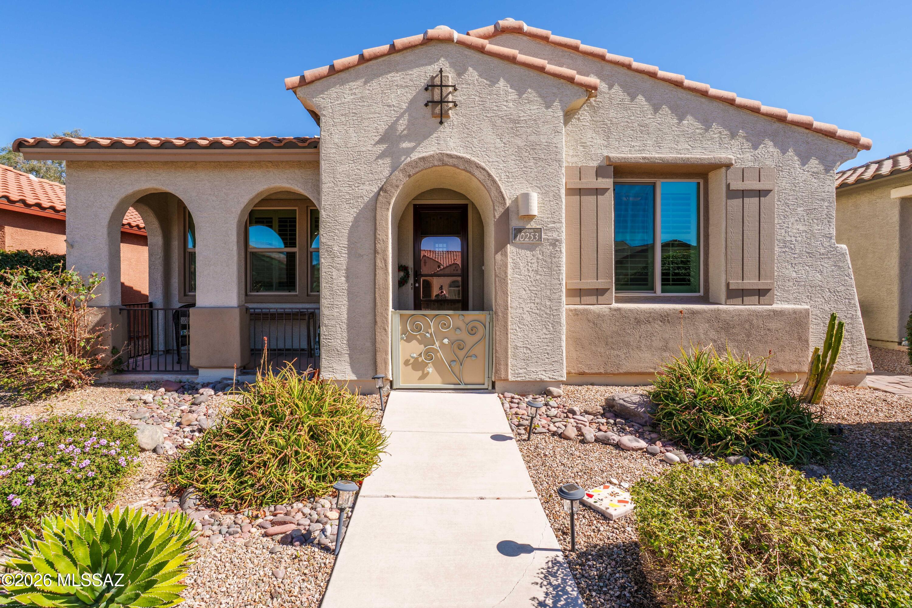 This one is special! A front patio invites you into the custom doors as you enter an immaculate home with virtually every upgrade you can imagine with an extra den/office/guest quarters, plantation shutters, custom tilework, built-in bookcase, ceiling sound system, island kitchen, granite countertops, lots of extra cabinetry, only the best appliances: LG fridge, double ovens, W/D included. Private courtyard, altrium patio, with custom brick pavers. Amazing master with high clerestory windows, high quality shelving, cabinets and drawers added in walk-in!