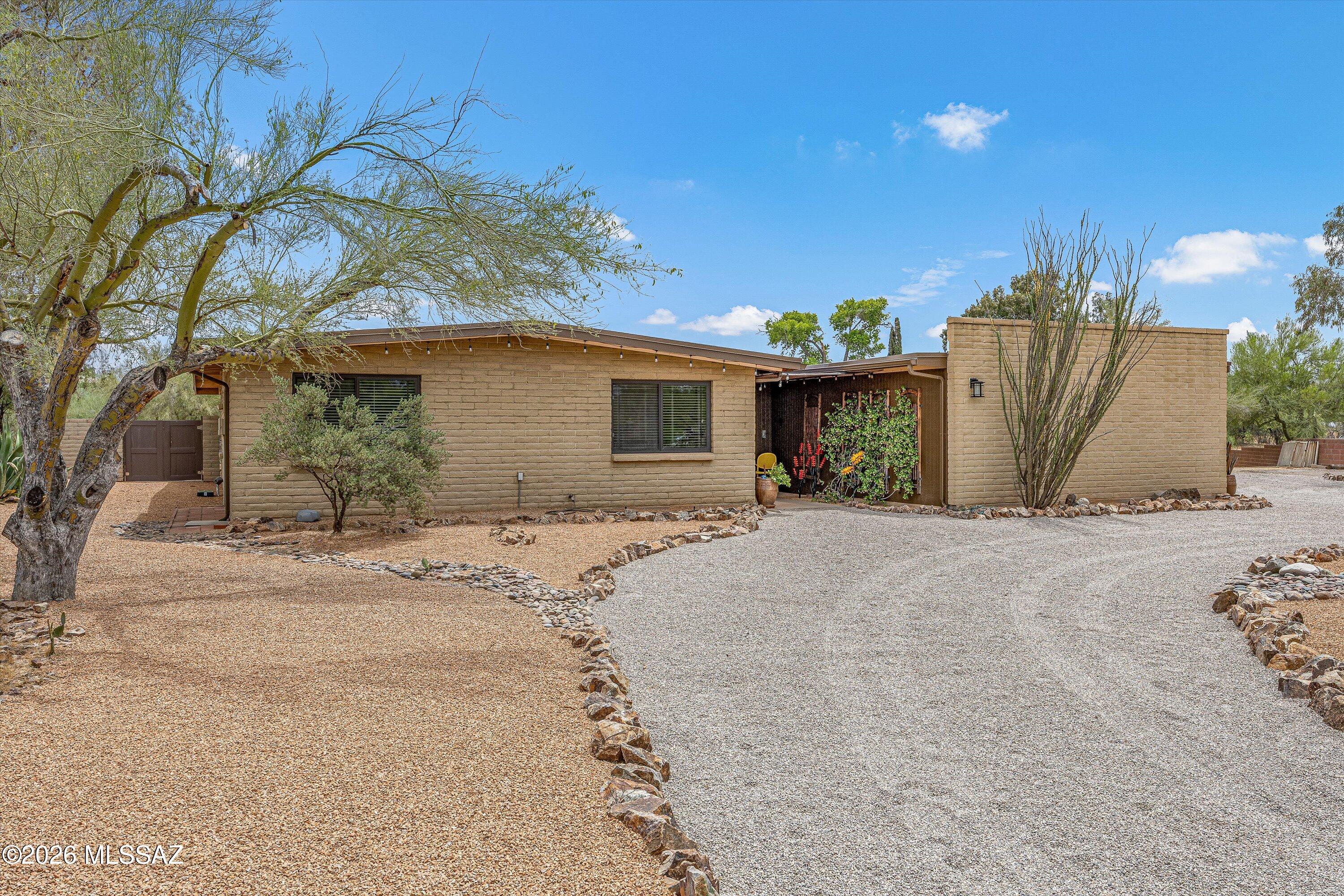 Fantastic home situated on a spacious lot in a well established community. A welcoming entryway opens to a generous living and dining area with views of the expansive backyard. The remodeled kitchen features newer stainless steel appliances and is complemented by a breakfast nook and family room just off the kitchen, creating a perfect space for everyday living and gatherings. the large primary suite offers a beautifully remodeled bathroom. Step outside to enjoy the resurfaced pool and a well designed ramada with a gas dining area, ideal for grilling and entertaining. A 10x10 Tuff Shed provides excellent extra storage. The home also includes three additional bedrooms and a guest bathroom. A large laundry room leads to the garage, which includes a workshop room. Newer HVAC & Water Heater.