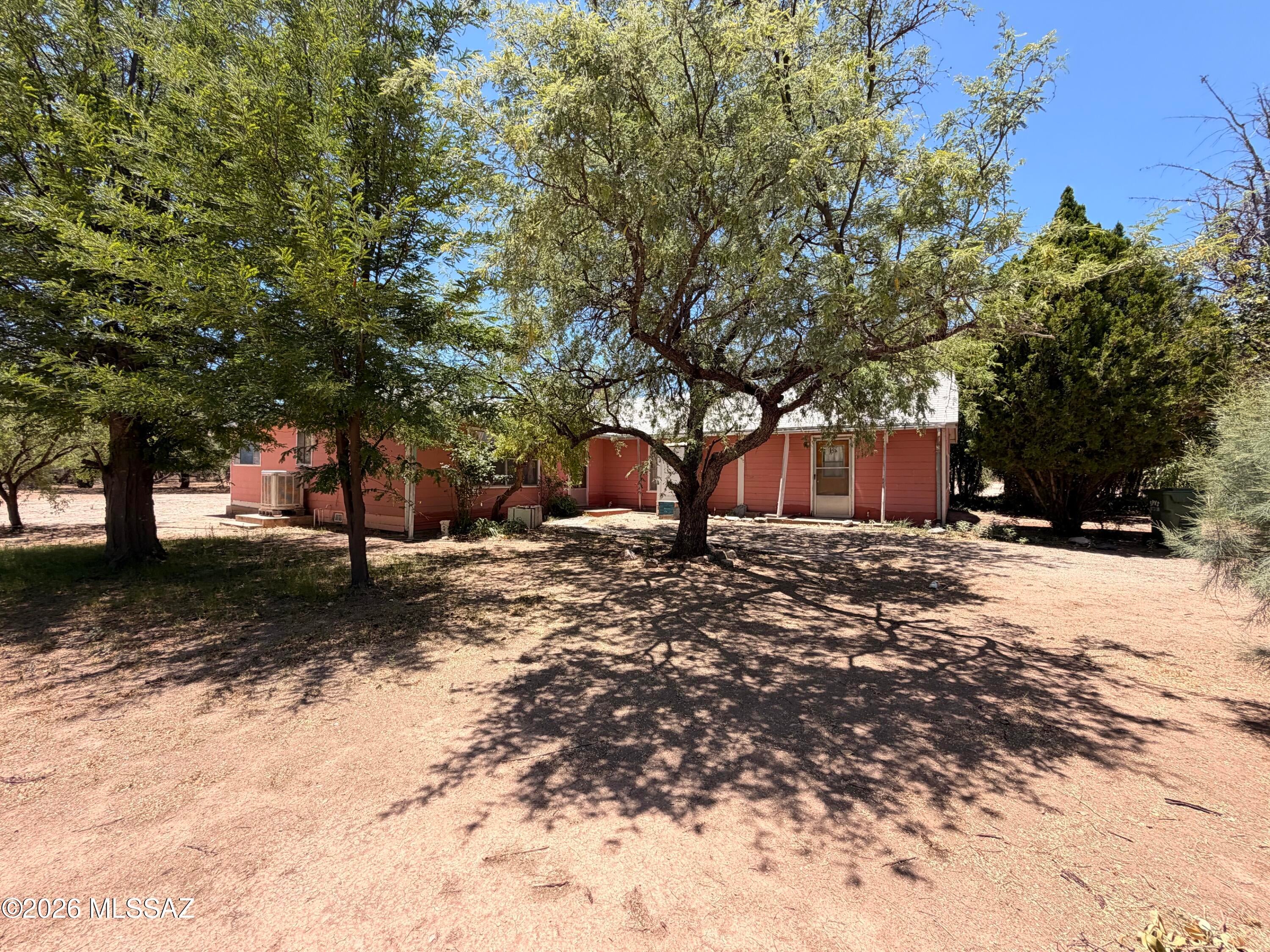 Exceptional commercial opportunity on high-visibility Highway 80 in the charming community of St. David.   In this section of HWY 80 there is a center turn lane, safe access to the property.  This versatile 2 acre general business-zoned property offers a rare combination of prime road frontage and a park-like setting shaded by mature trees.  With the highway frontage about 1.72 ac is useable.  A spacious 2,200 sq ft home adds immediate utility or living quarters. Whether you're launching a new venture or expanding an existing one, this property delivers the space, location, and zoning to make it happen. 55-645407
