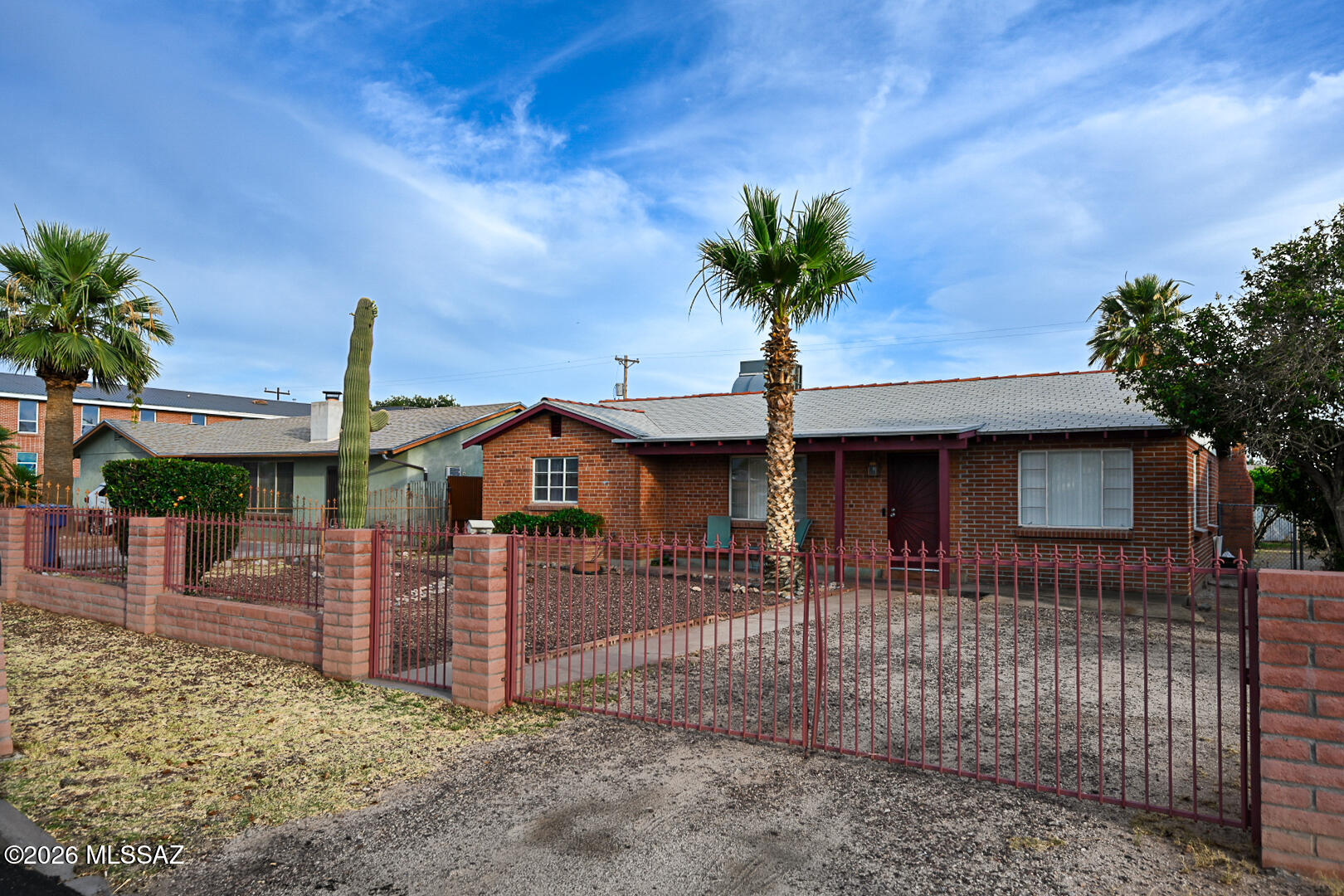 This mid century home located near Reid Park offer easy access to the University of Arizona. Offers 3 bedrooms, 2 baths, 1,774 sq ft of living space. Functionality and long-term value. The large lot and back yard are perfect for entertaining, while the classic brick and solid masonry construction create a charming first impression. Indoor laundry room adds convenience, and the desirable location makes this solid home a smart investment with endless potential for personalization.