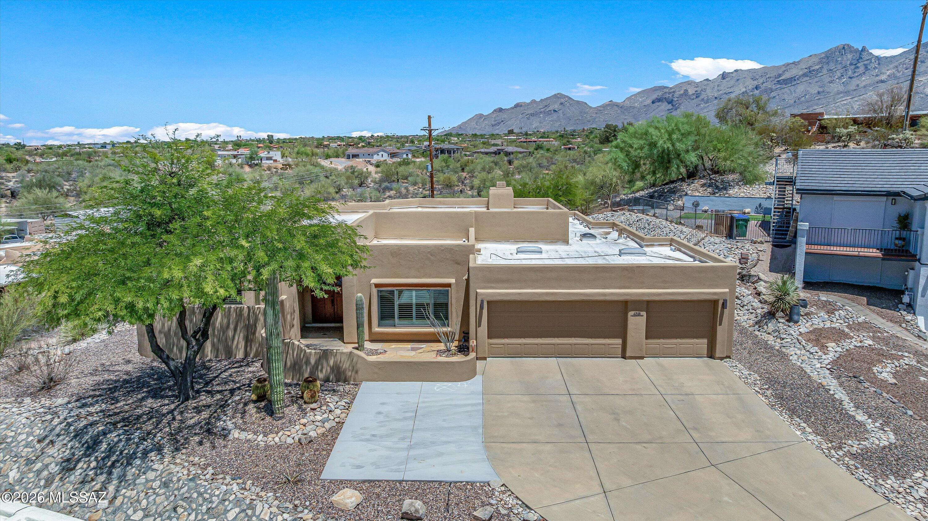 This private, 4-bedroom home sits inside a gated community and has no rear neighbors. It has an incredibly flexible split-bedroom floorplan with an open concept kitchen + living space, but also has additional room to make a cozy den, office, library- whatever you may need. The 3-car garage has a beautiful epoxy coat and the extended driveway offers lots of parking. The entry has a pretty flagstone courtyard, and the backyard is beautifully finished with turf, lighting, fire pit and a gazing fountain if you get tired of looking at the mountains from the large, covered patio. The owner has put a lot of thought into upgrades to make living comfortable and easy- from electronic blinds for patio shading, to stone-surround for the gas fireplace, a water softener + more. NO deferred maintenance.