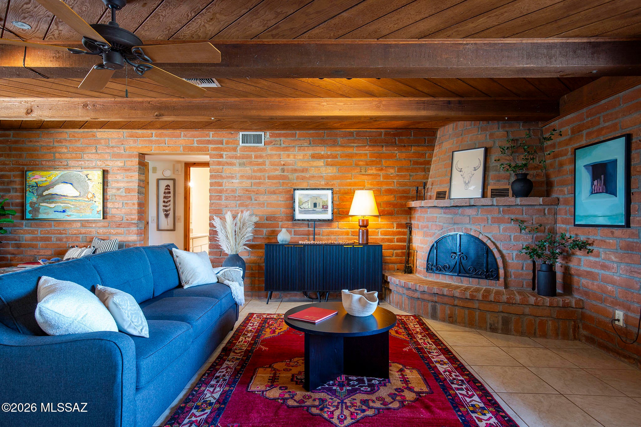 Set in the far northwest corner of more than 10 acres, this home has room to breathe. Sweetwater Preserve borders the property on two sides, with desert habitat and views in every direction: the Catalinas and Rincons to the east, A-Mountain to the south, and the Tucson Mountains west. After sunset, lights stretch from OroValley across the city.
The home was built for comfort, uncomplicated living, with the surrounding landscape as its greatest luxury. There's space to watch the light change on the mountains, enjoy the quiet, and make a life that feels connected to the desert.
Here's a place many neighbors have stayed for years, where the connection to the land runs deep. For its next owner, it offers something increasingly hard to find: space, a remarkable setting, a chance put down root Camino de Oeste has paid solar installed by Technicians for Sustainability, newer HVAC system, a cistern system, deed restricted so the property cannot be divided; is on septic. 3 bedroom/2 bathroom main house with 3 car garage, plenty of storage throughout the garage area, a kennel for the little pets for their protection, Casita studio with separate Murphy bed area, bath and fireplace, and mini split make this a fabulous in-law suite or whatever you can dream up! If horses are your thing, bring them and ride right out to the Sweetwater Preserve. This is a truly unique property and unique opportunity.