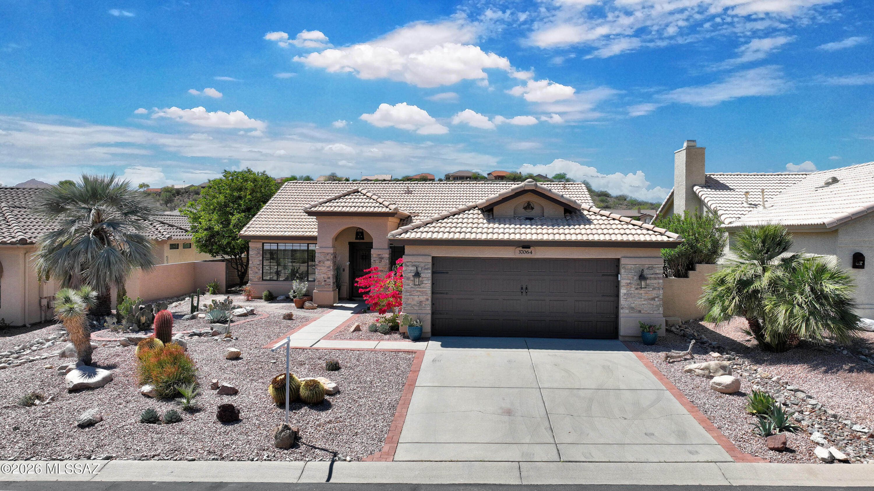Immaculately redesigned Diego model perched above the Catalina Golf Course, offering sweeping mountain and fairway views of holes #3 and #9. The vaulted great room with fireplace flows into a chef's kitchen with granite countertops, stainless steel appliances, 8-burner gas range, dual convection ovens, and pot filler. A light-filled breakfast nook and a serene primary suite with patio access, spa-like bath, and expanded closet elevate daily living. Upgrades include new concrete overlay flooring, roof, HVAC, and water heater. Enjoy sunset views from the expansive patio and a generous yard with space for a pool, spa, or casita.
