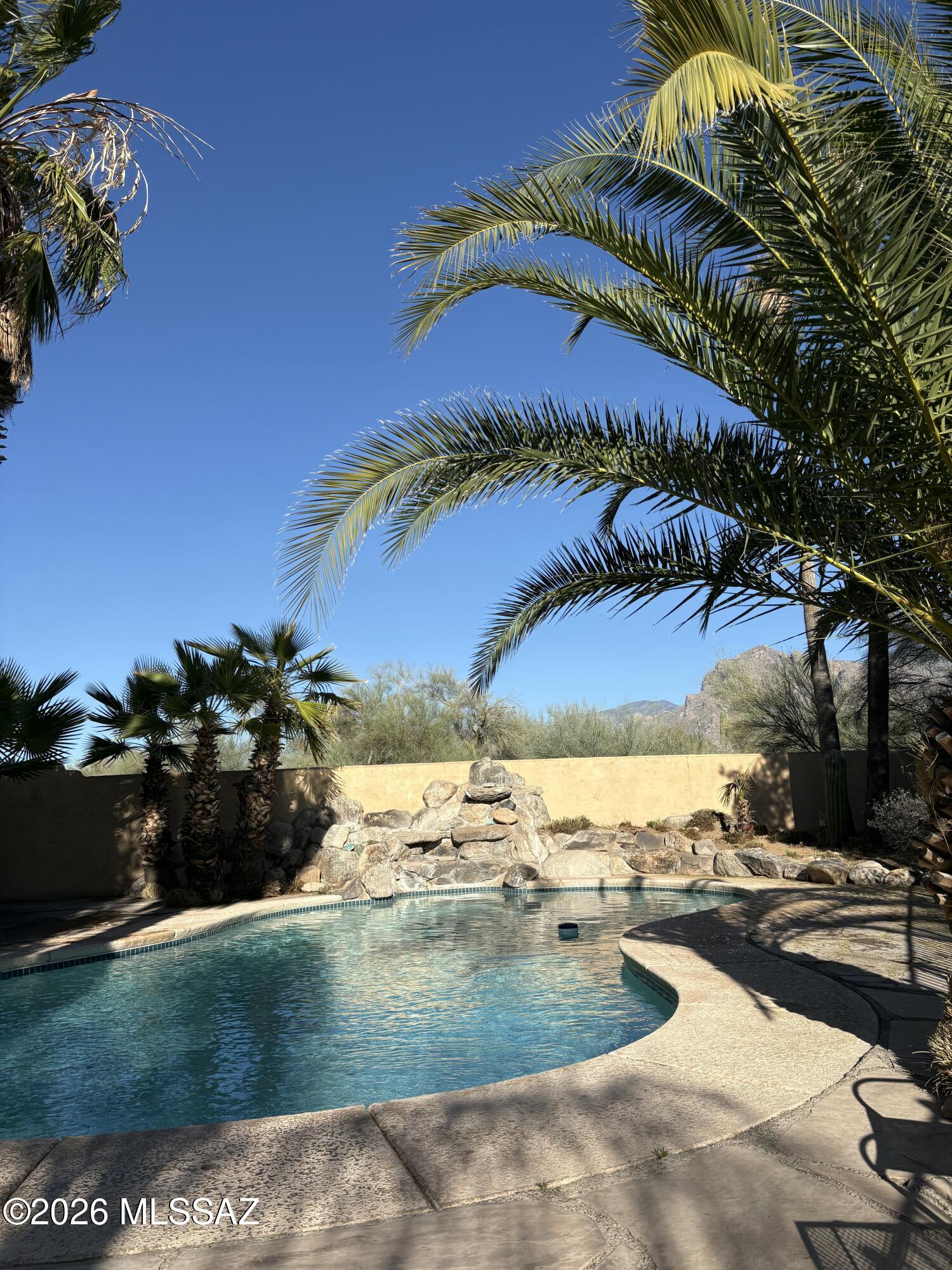 Ideally located near amenities while still offering space and privacy, this beautifully situated property blends comfort, convenience, and classic desert charm.
Step inside to discover light-filled living spaces, a functional layout, and inviting gathering areas perfect for both everyday living and entertaining. Large windows frame Arizona's stunning natural beauty while allowing warm, natural light to pour in throughout the day. Whether you're sipping morning coffee under the Arizona sky or enjoying a sunset with mountain views, this property captures the essence of Tucson living.