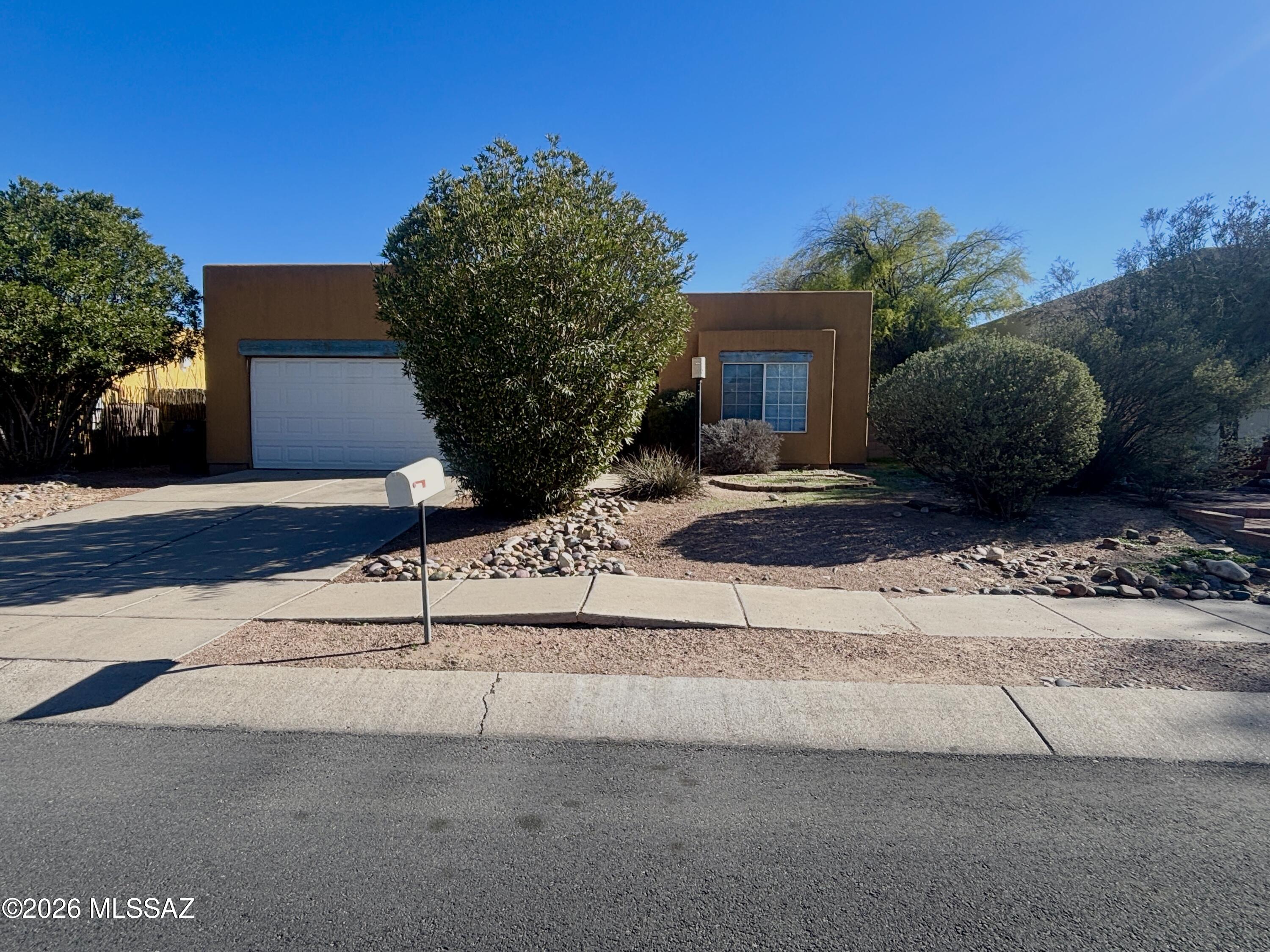 Great location for this 3 BR, 2 Bath Home near Udall Park!  Vaulted ceilings, ceramic tile flooring in main living areas and New Carpet in bedrooms, Fireplace in Living Room, Great Room floor plan, covered patio, walled yard, Central AC. Call for appointment!