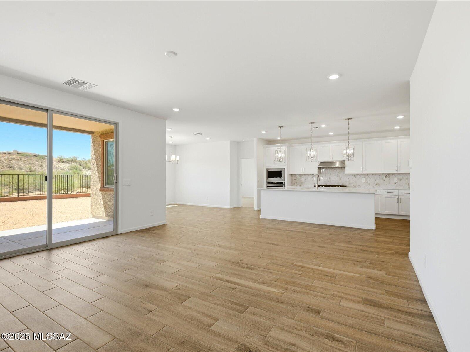 Oro Valley. Energy Efficient. Move in Ready.

The Ruby floorplan features a 3-car tandem garage and a charming front porch, offering both style and functionality. This 4-bedroom, 2.5-bath home showcases an expansive great room perfect for entertaining, along with a private primary suite for a relaxing retreat.
Now selling in Oro Valley, Naranja Trails is a gated community with homes starting in the low $600s, offering scenic walking trails and a prime location just across from beautiful Naranja Park. Every home is built with innovative, energy-efficient features designed to enhance comfort, health, and long-term savings.
